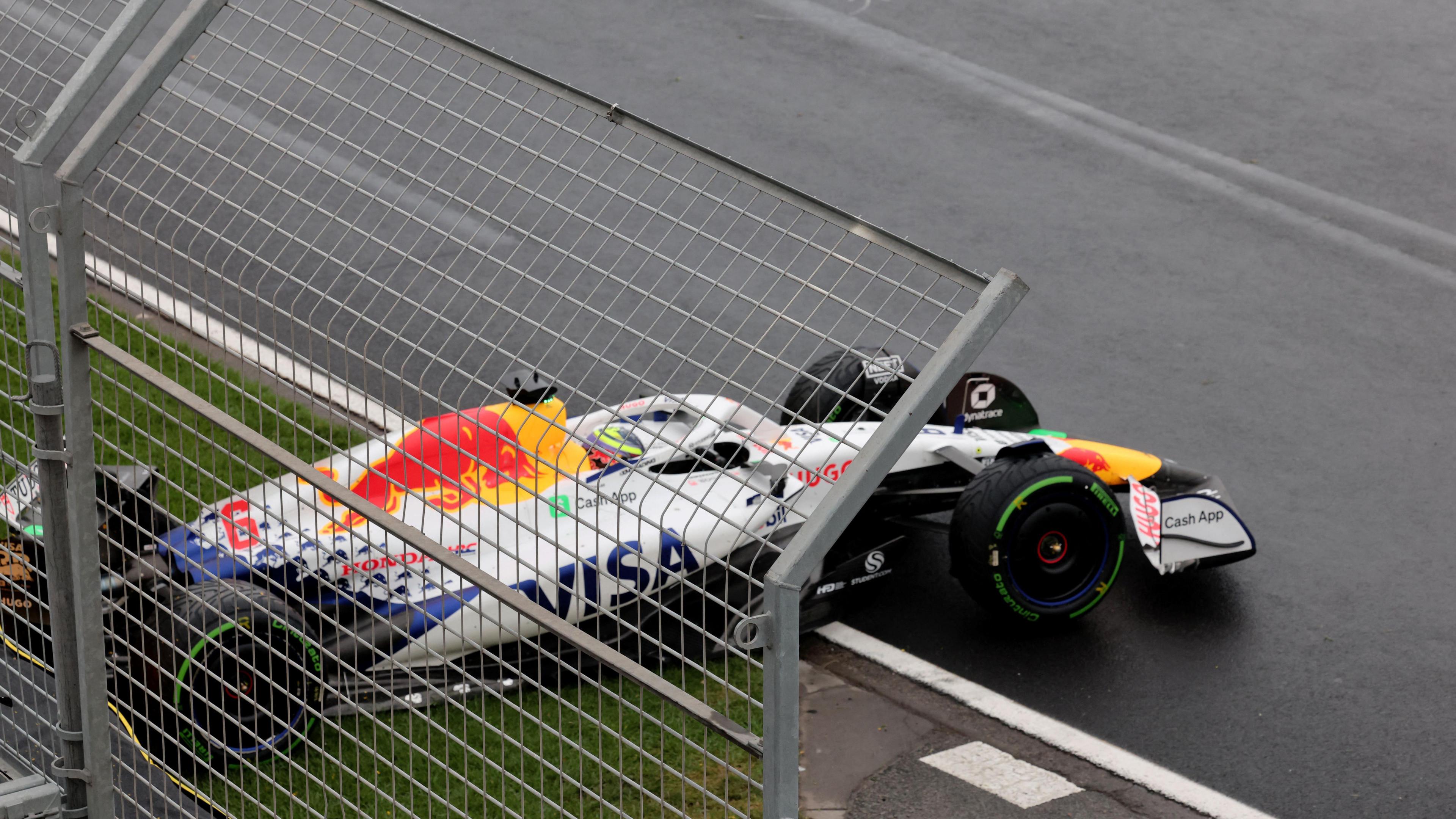 The damaged Racing Bulls car of Isack Hadjar lies across the track after he crashed on the formation lap of the Australian Grand Prix