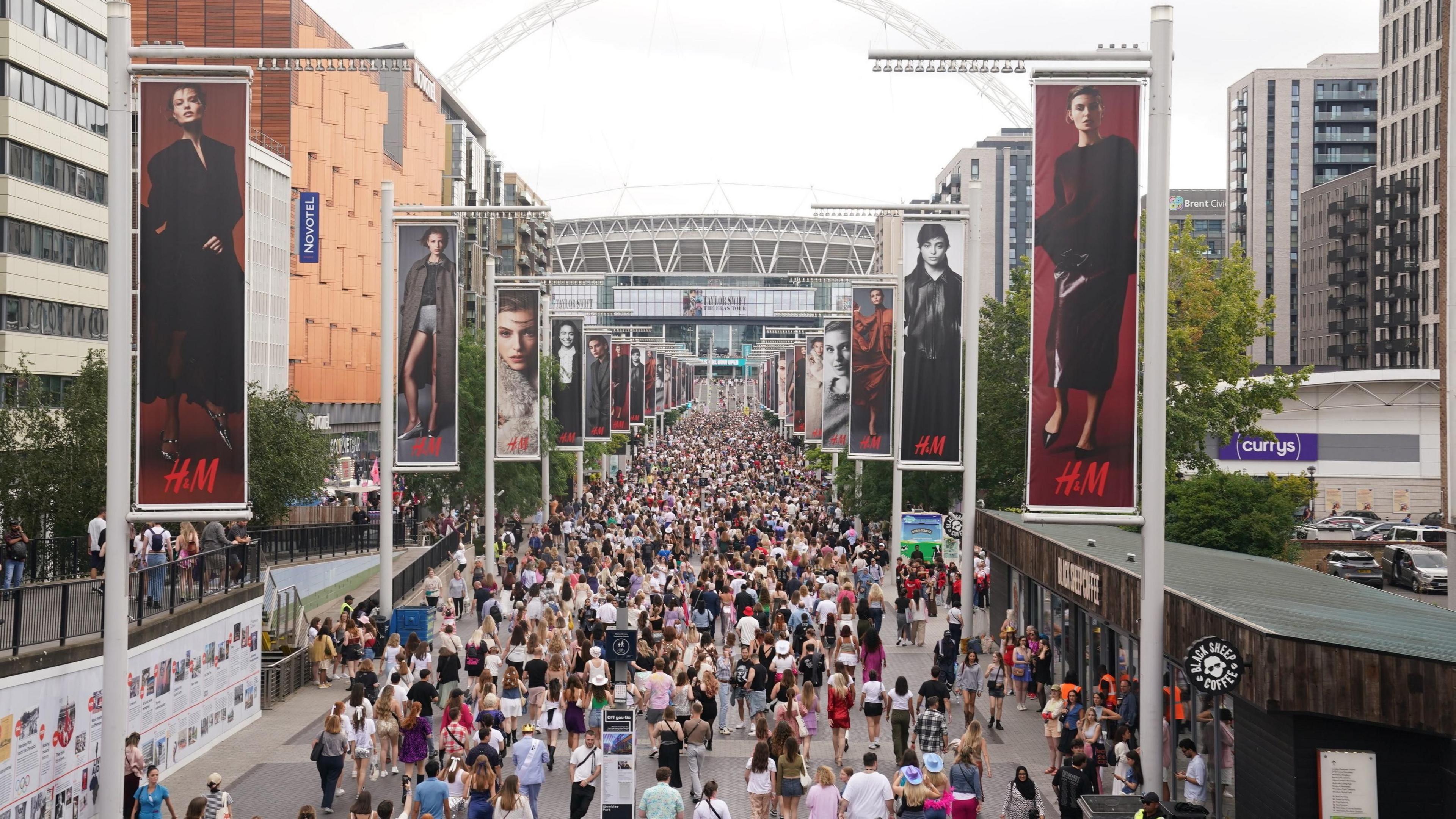 Fans gather outside Wembley Stadium in north west London, ahead of a Taylor Swift's Eras Tour concert.