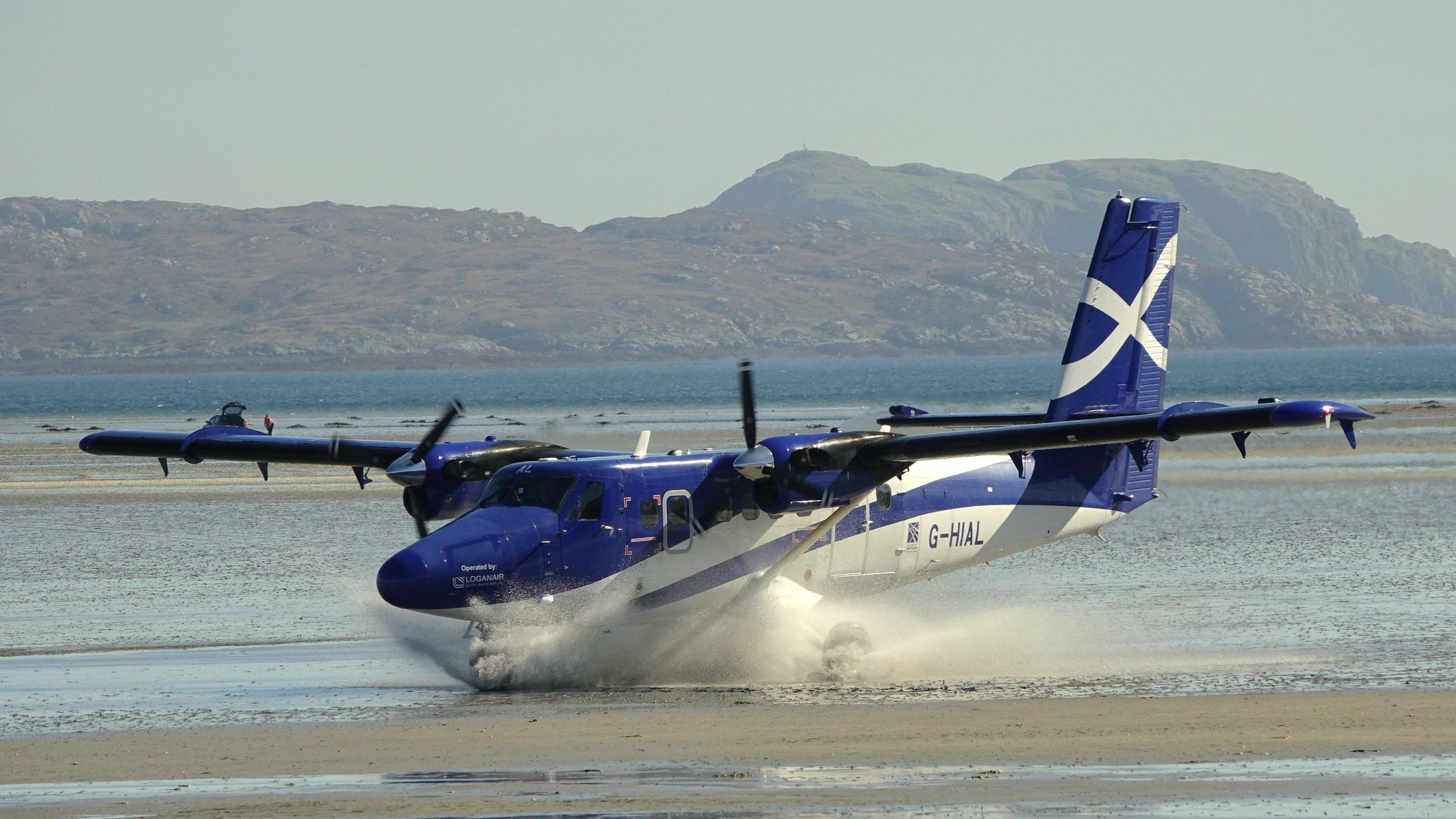 Plane landing on Barra beach