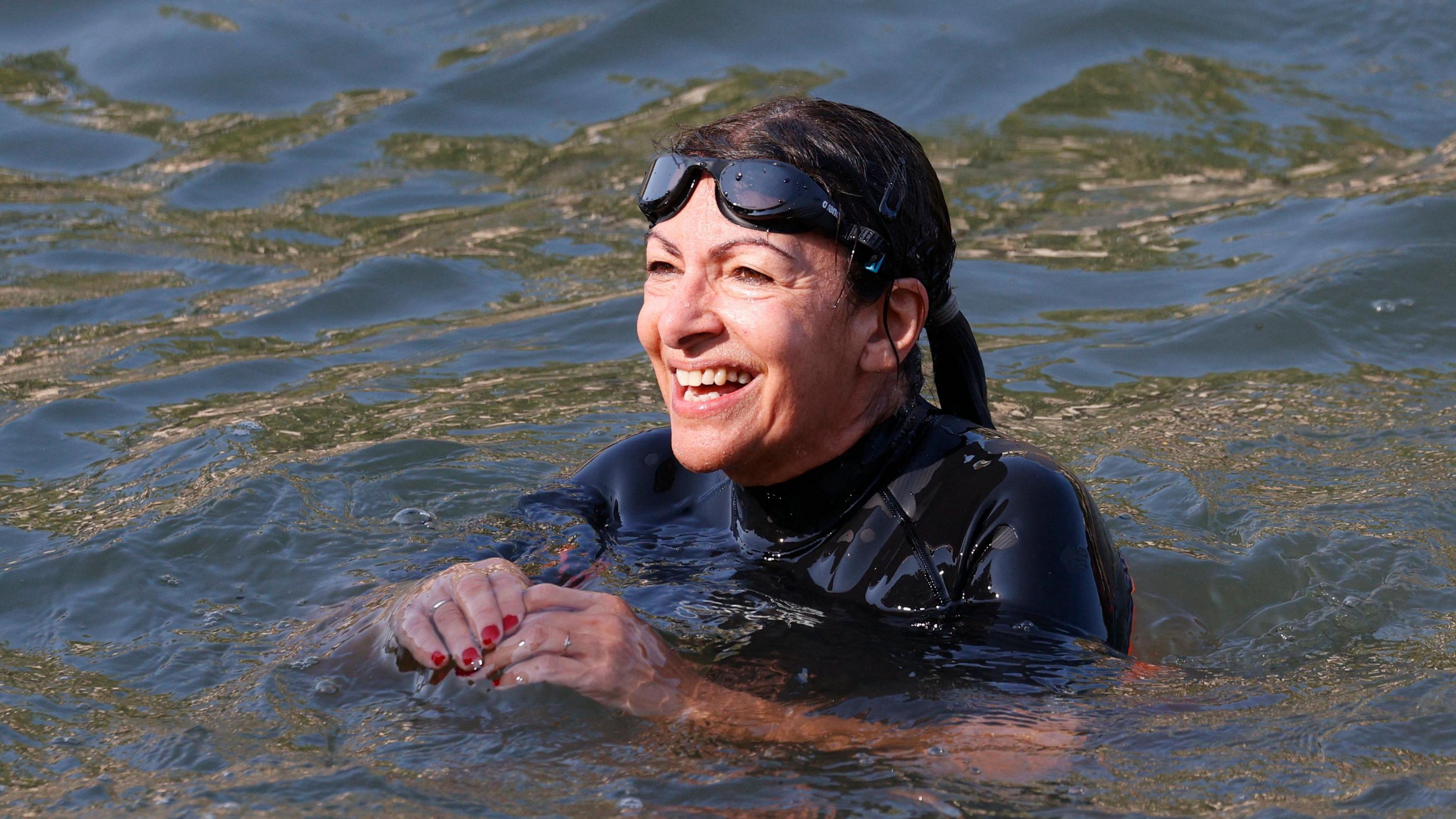 Mayor of Paris, Anne Hidalgo swimming in the Seine.