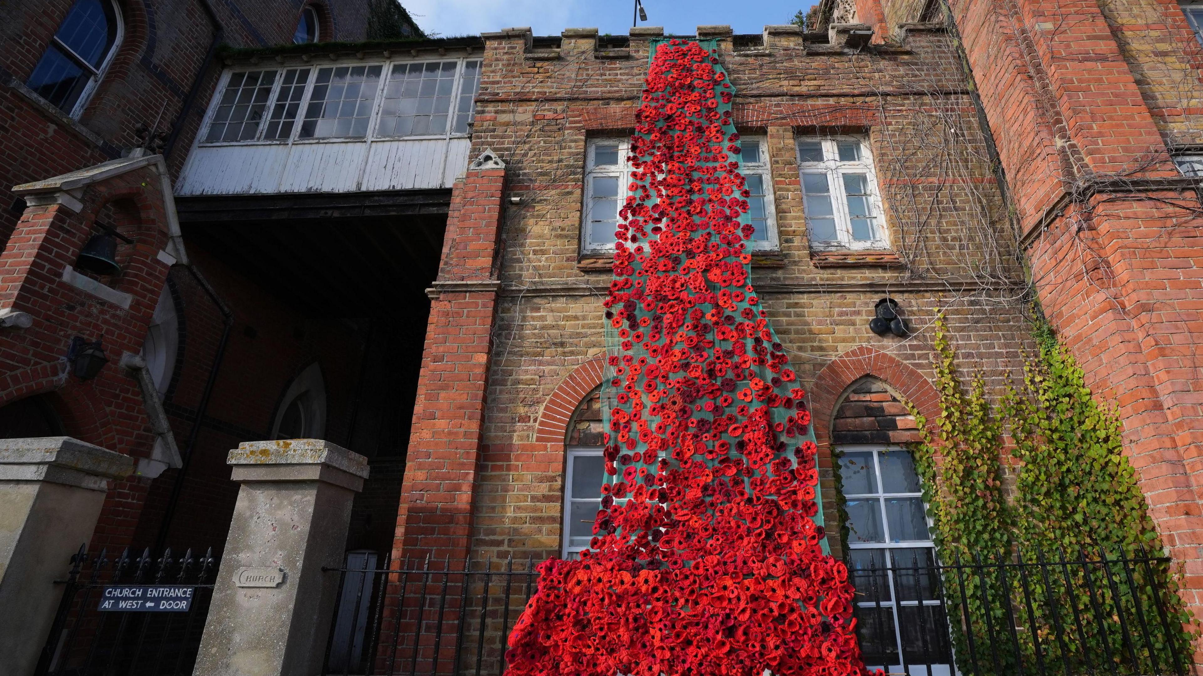 A poppy display spills over the roof at the Sailor's Church in Ramsgate, Kent