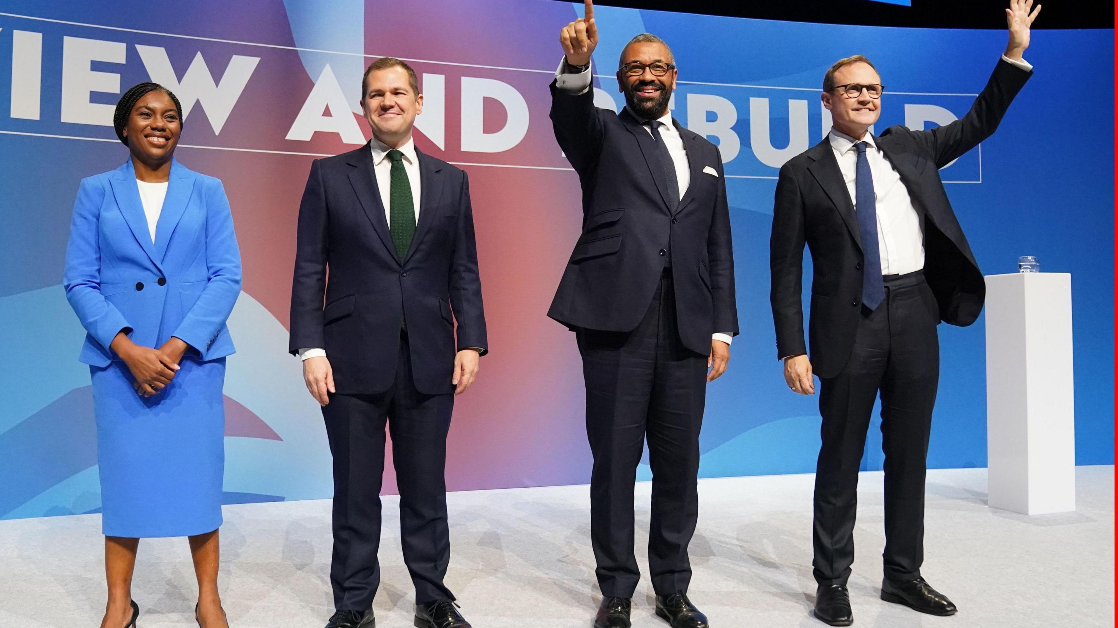 The four leadership contenders Kemi Badenoch, Robert Jenrick,  James Cleverly and Tom Tugendhat standing on stage at the Conservative party conference in Birmingham. 