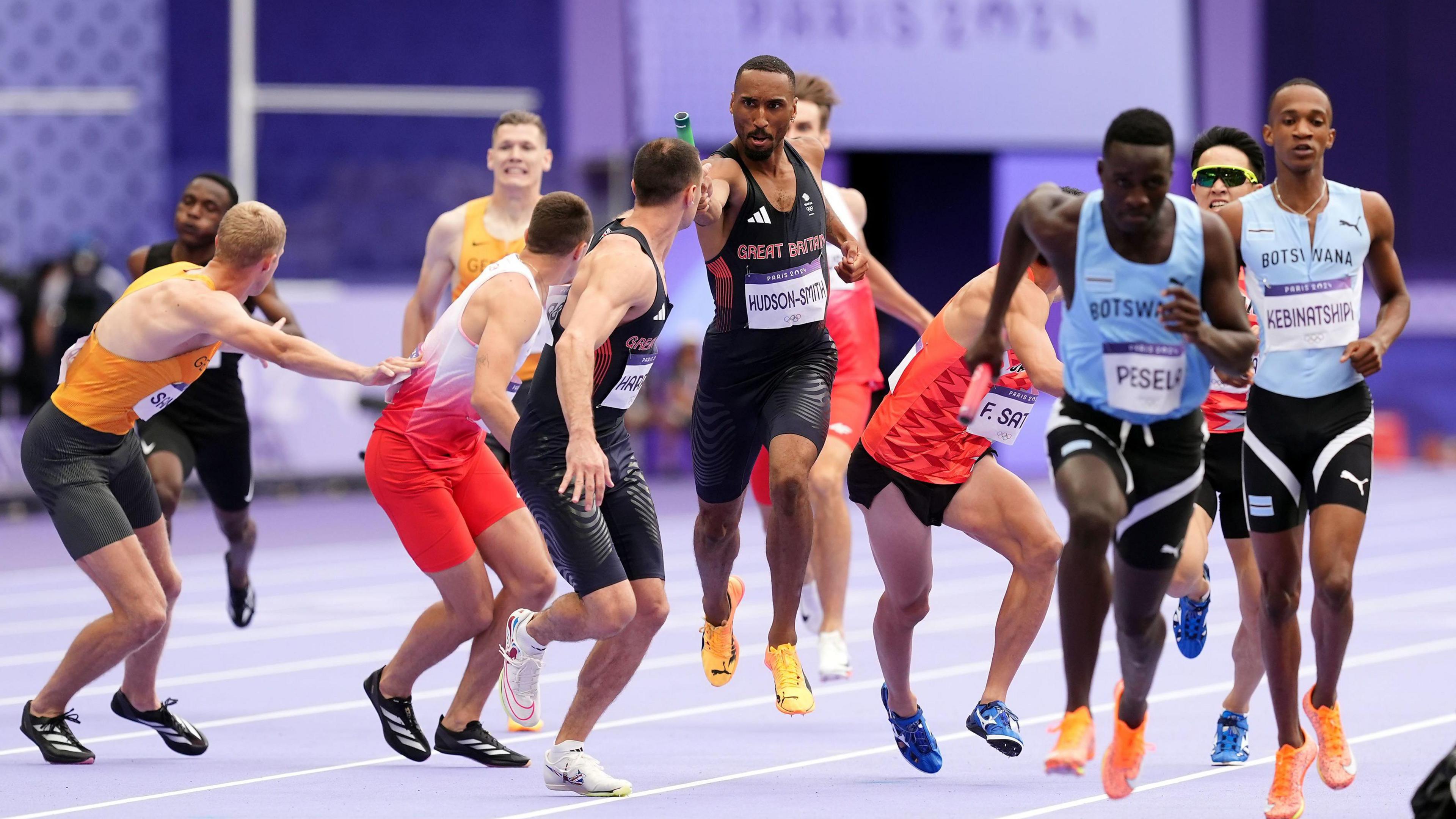 Great Britain's Matthew Hudson-Smith passes the baton to teammate Toby Harries during the men's 4 x 400m Relay 