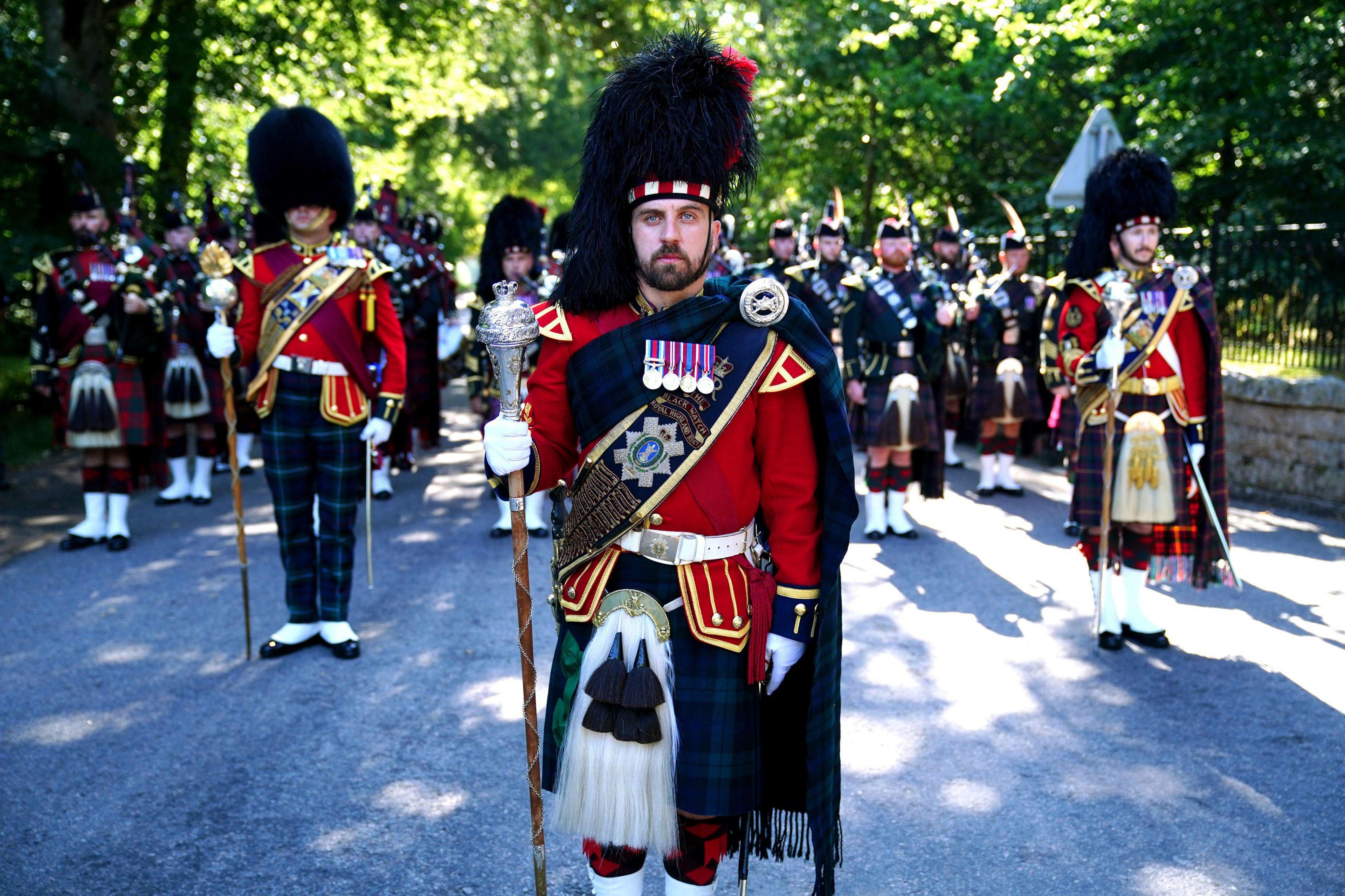 The pipe band of 3 & 4 SCOTS, Royal Regiment of Scotland as King Charles III carries out an inspection of the Balaklava Company, 5th Battalion, The Royal Regiment of Scotland, at the gates of Balmoral, as he takes up summer residence at the castle. 