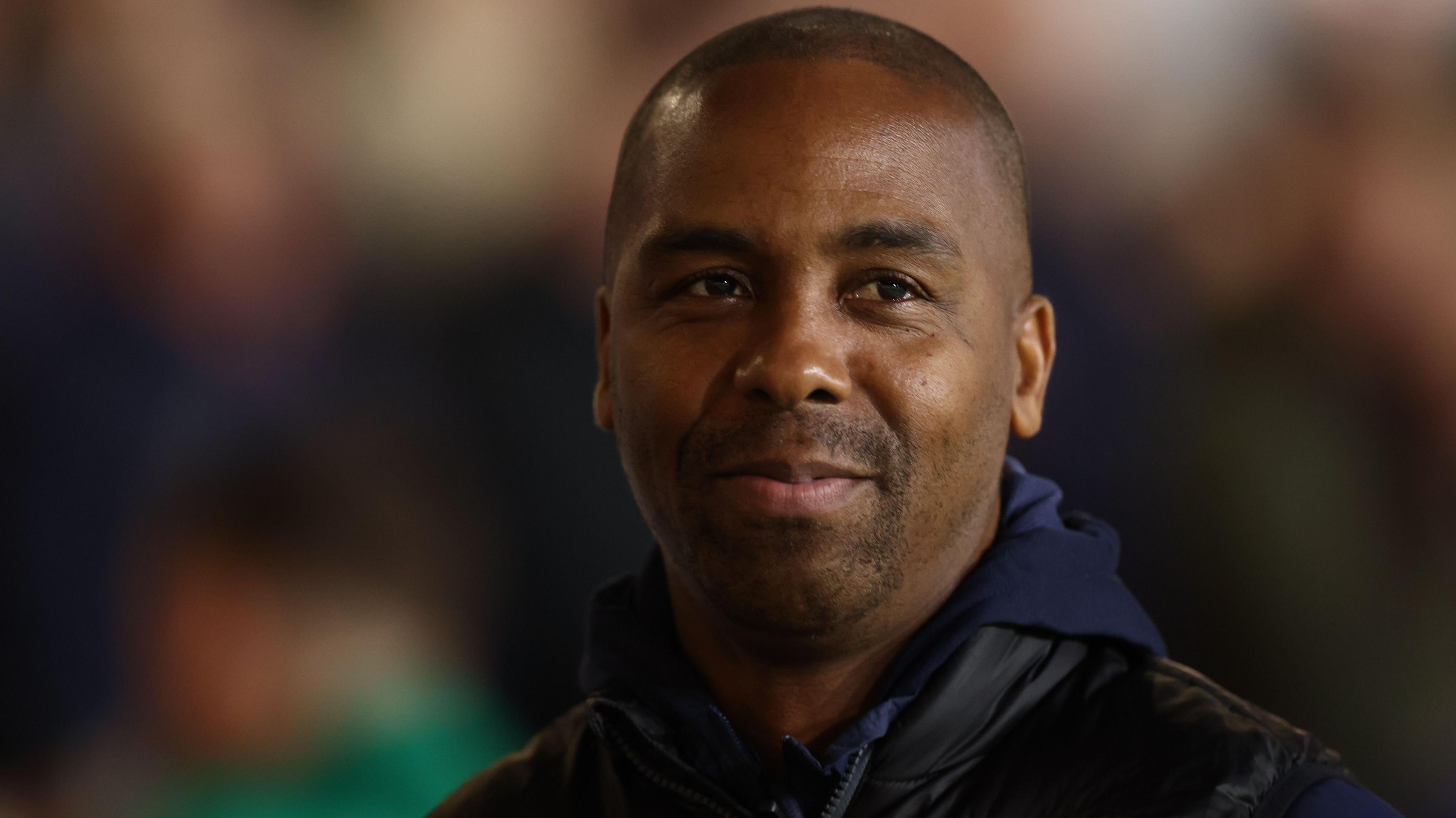 Walsall head coach Darren Byfield looks on from the touchline