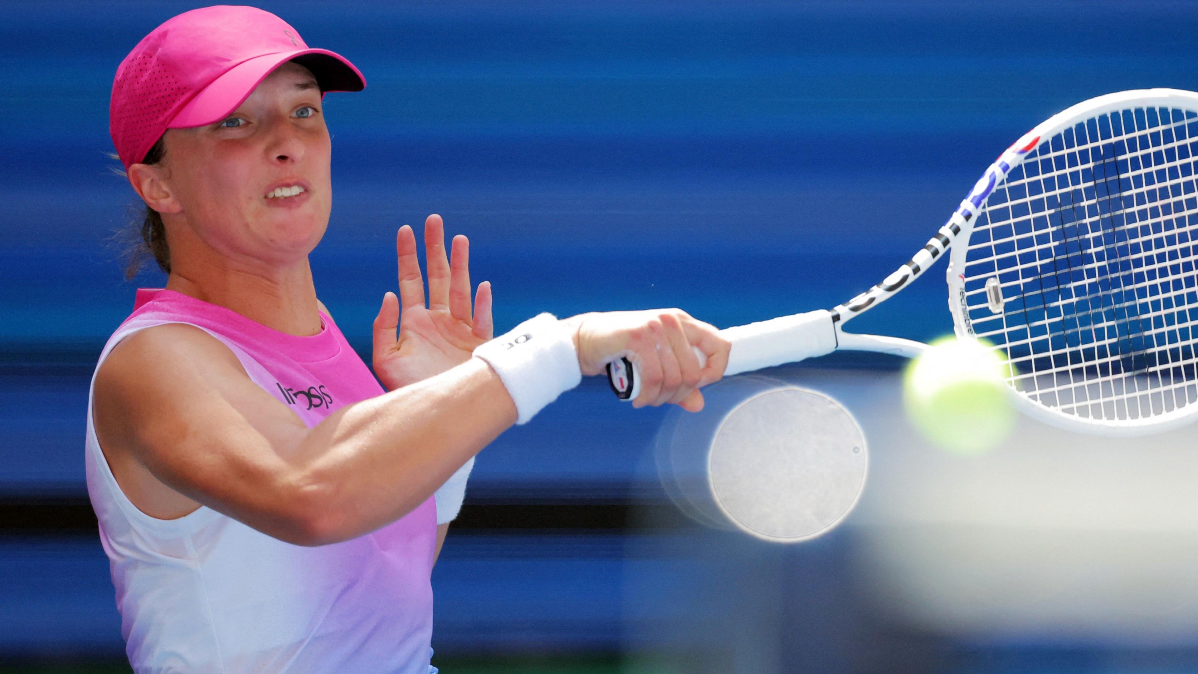 Iga Swiatek hits a forehand at the US Open