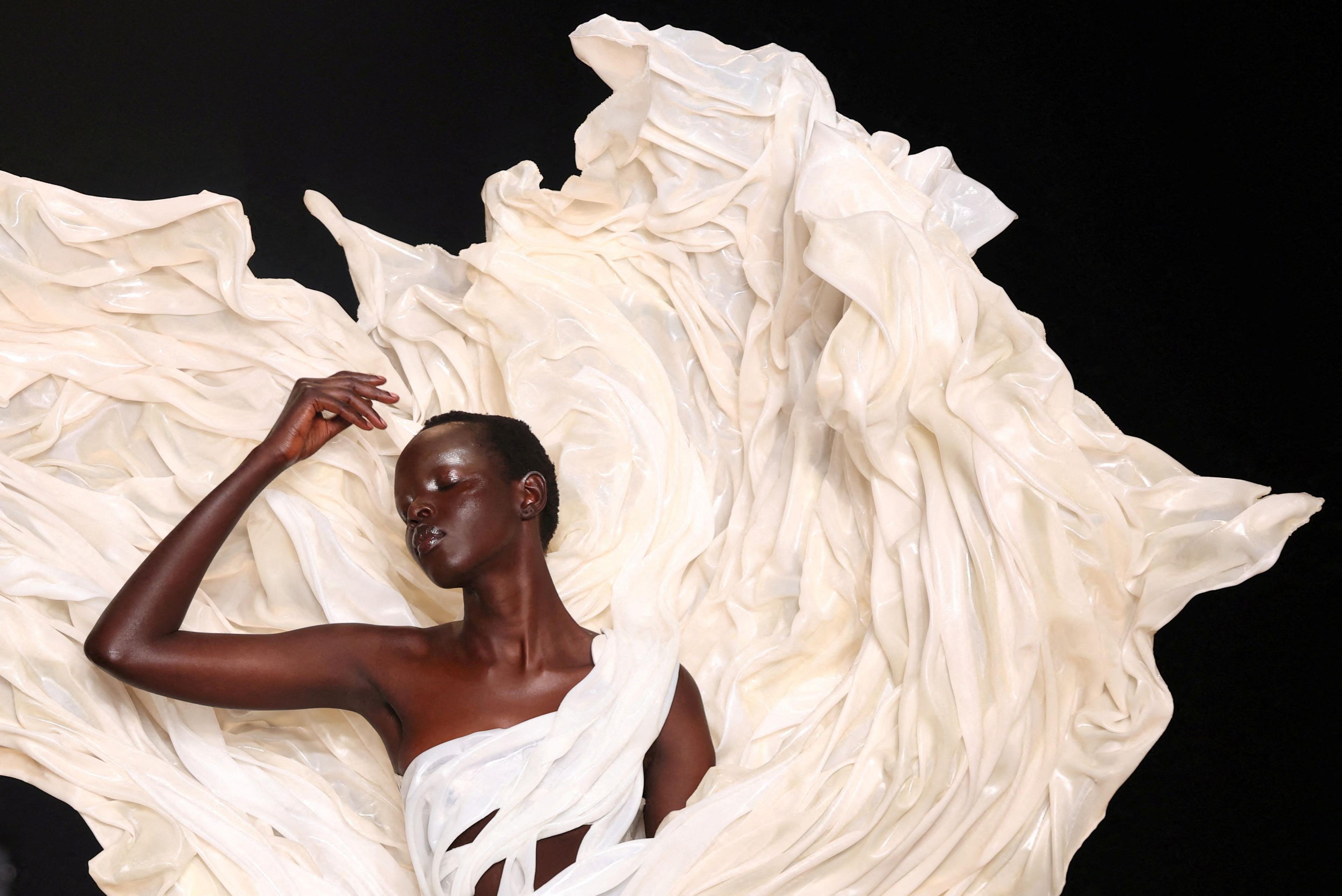 A model presents a creation by designer Iris van Herpen as part of her Haute Couture Fall/Winter 2025-2026 collection show in Paris, France, July 7, 2025.