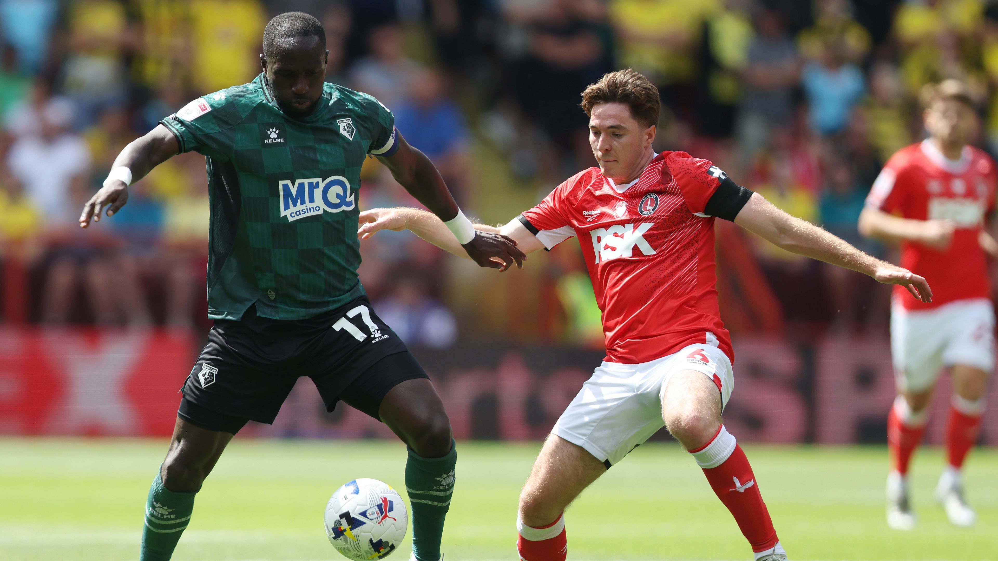 Moussa Sissoko challenges for the ball with Conor Coventry