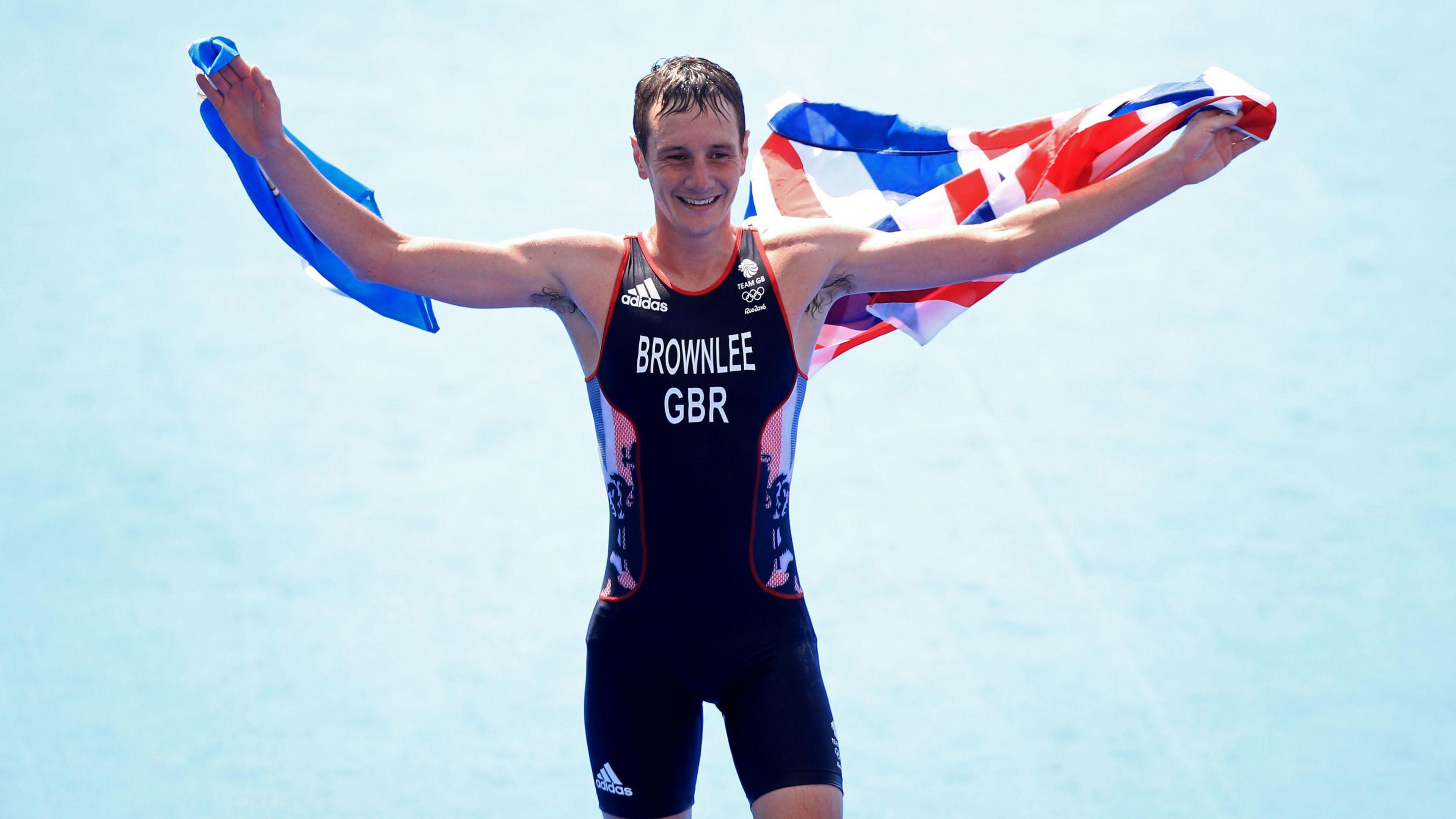 Alistair Brownlee draped in a Union flag.