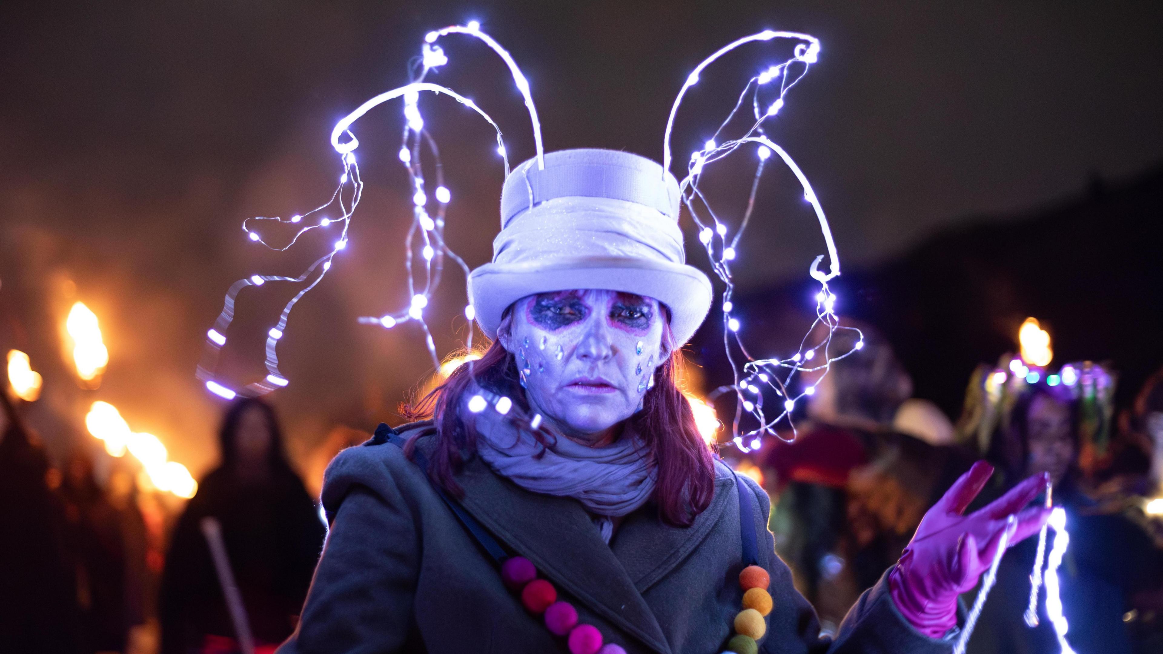 A lady wearing a light emitting hat