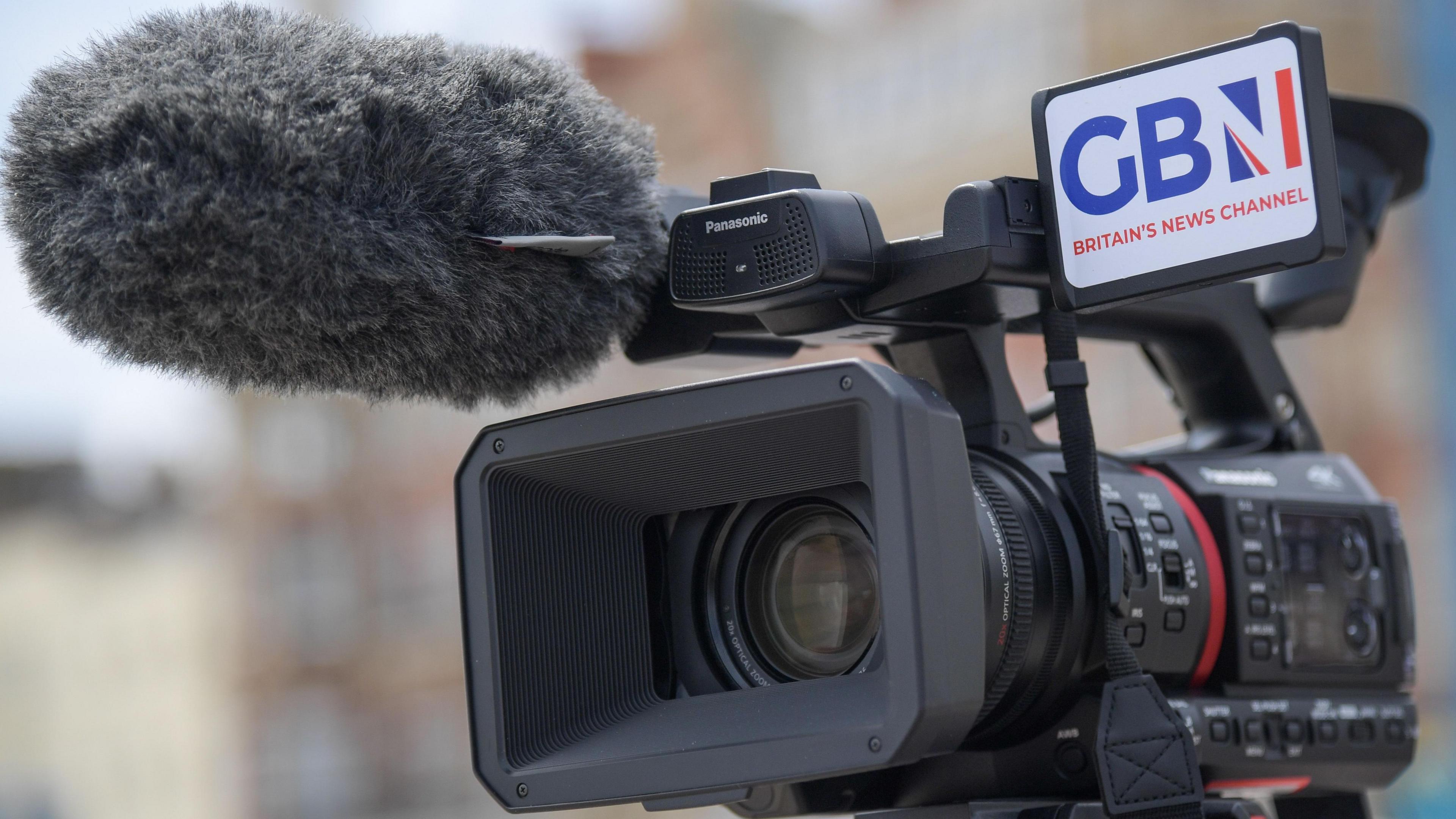 A video camera with GB News branding