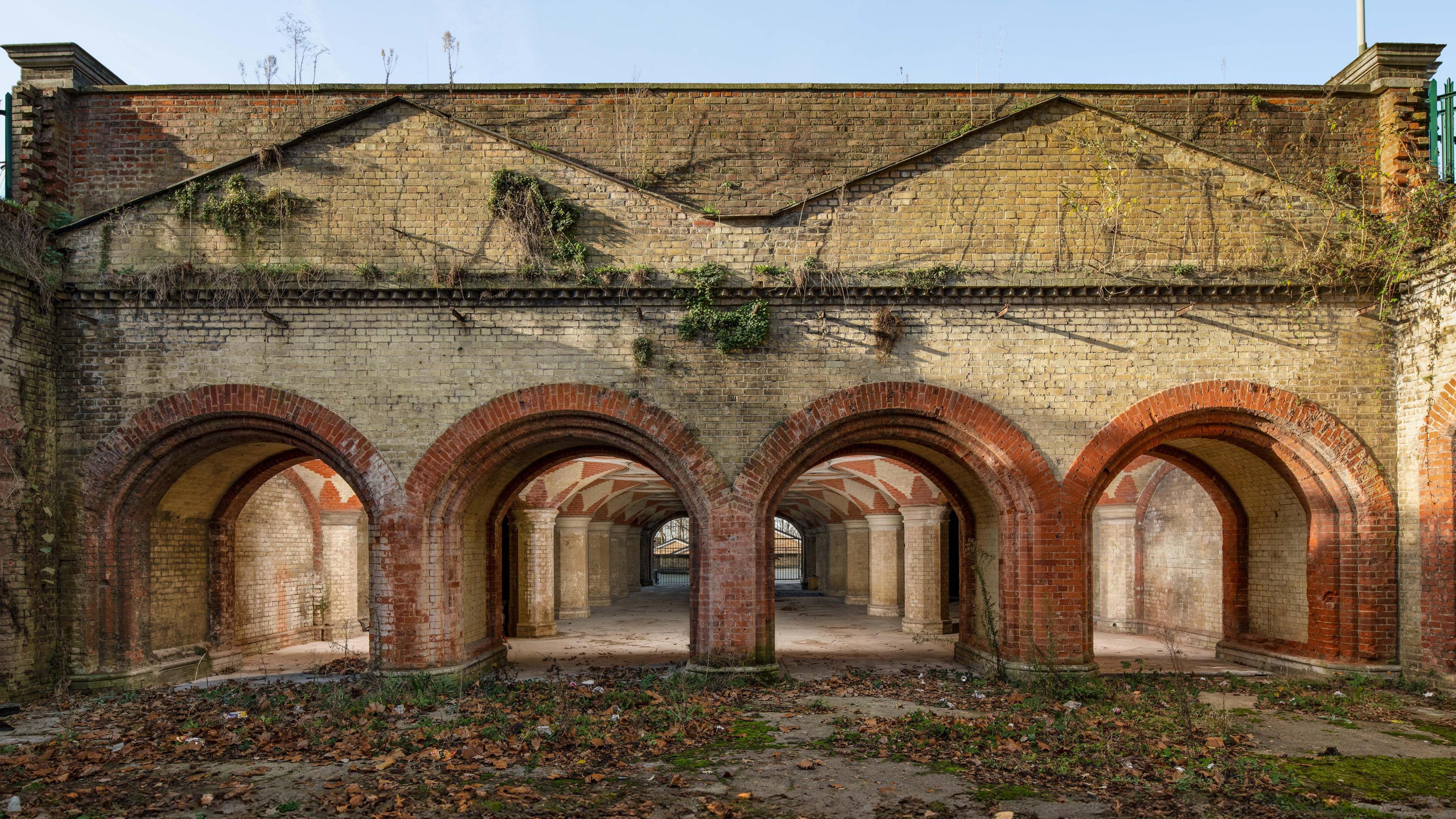 The Crystal Palace Subway is a richly decorated underpass with eighteen stone columns, evenly spaced and topped by terracotta-and-cream brickwork fanned vaults. The subway runs under the Crystal Palace Parade. Built in 1865 by Charles Barry Junior as an entrance to the Crystal Palace for those arriving by train.. View from east.