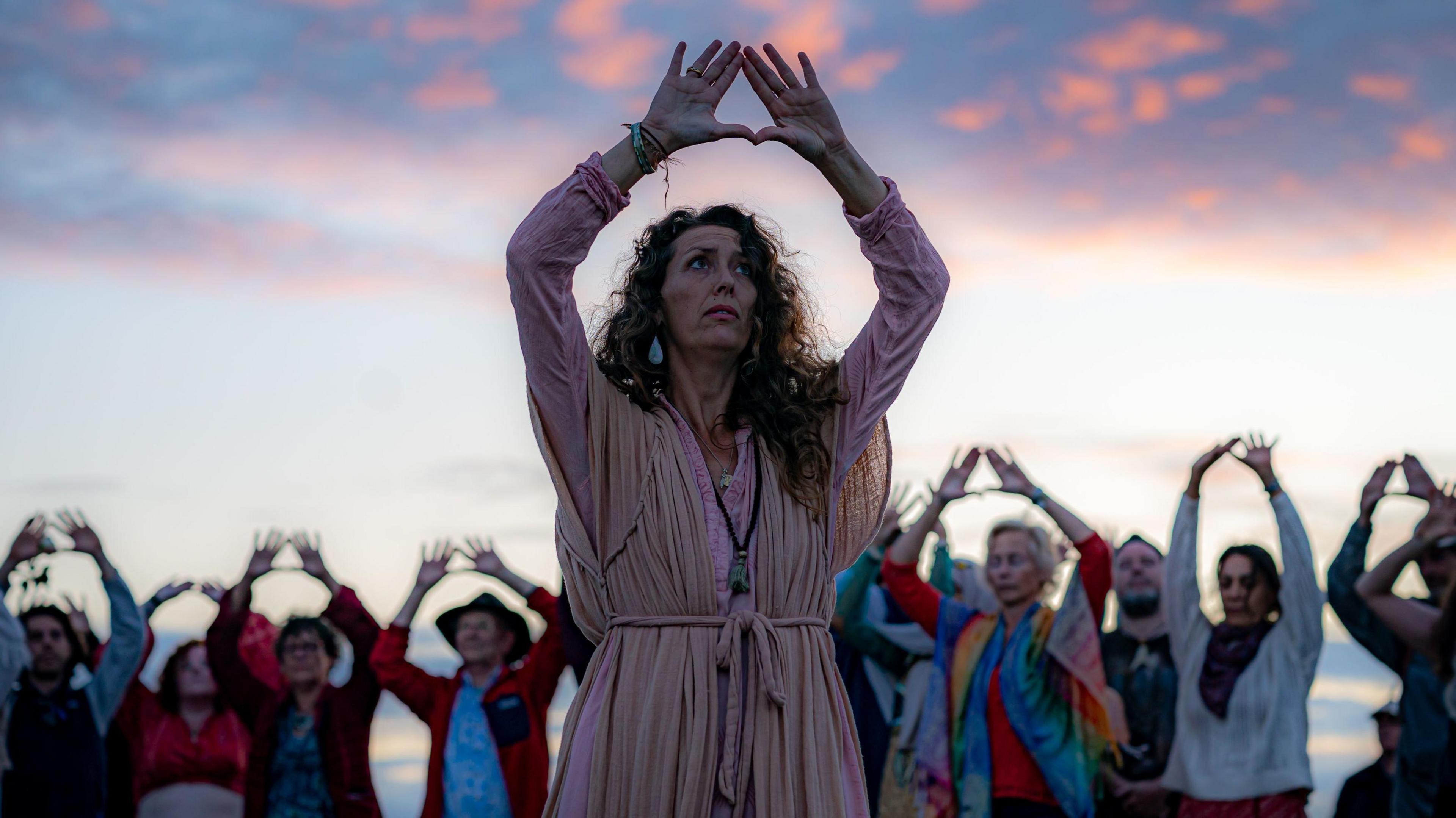 Caroline Glazebrook raising her arms