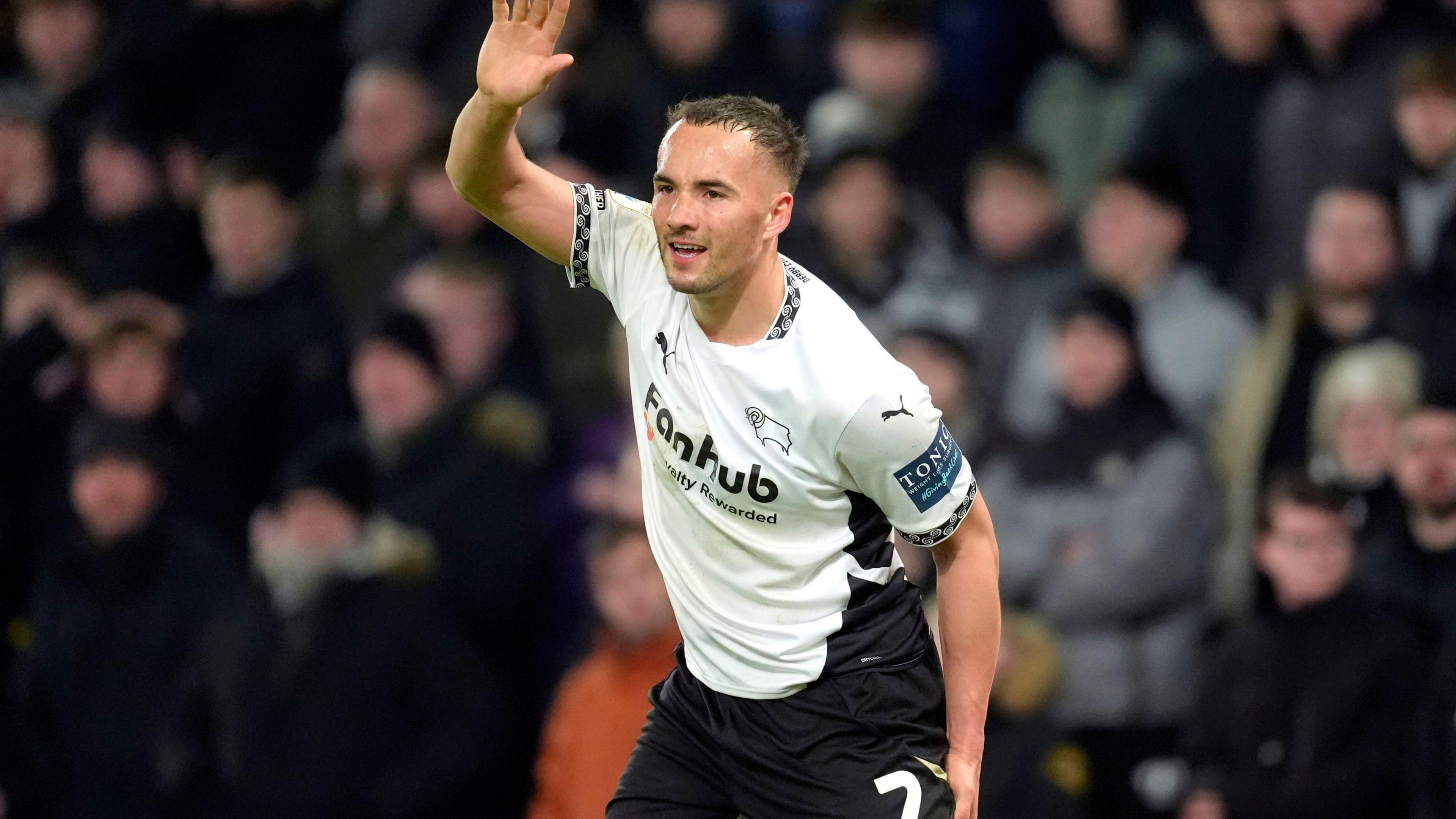 Kane Wilson left the Pride Park pitch clutching at his hamstring after suffering an injury