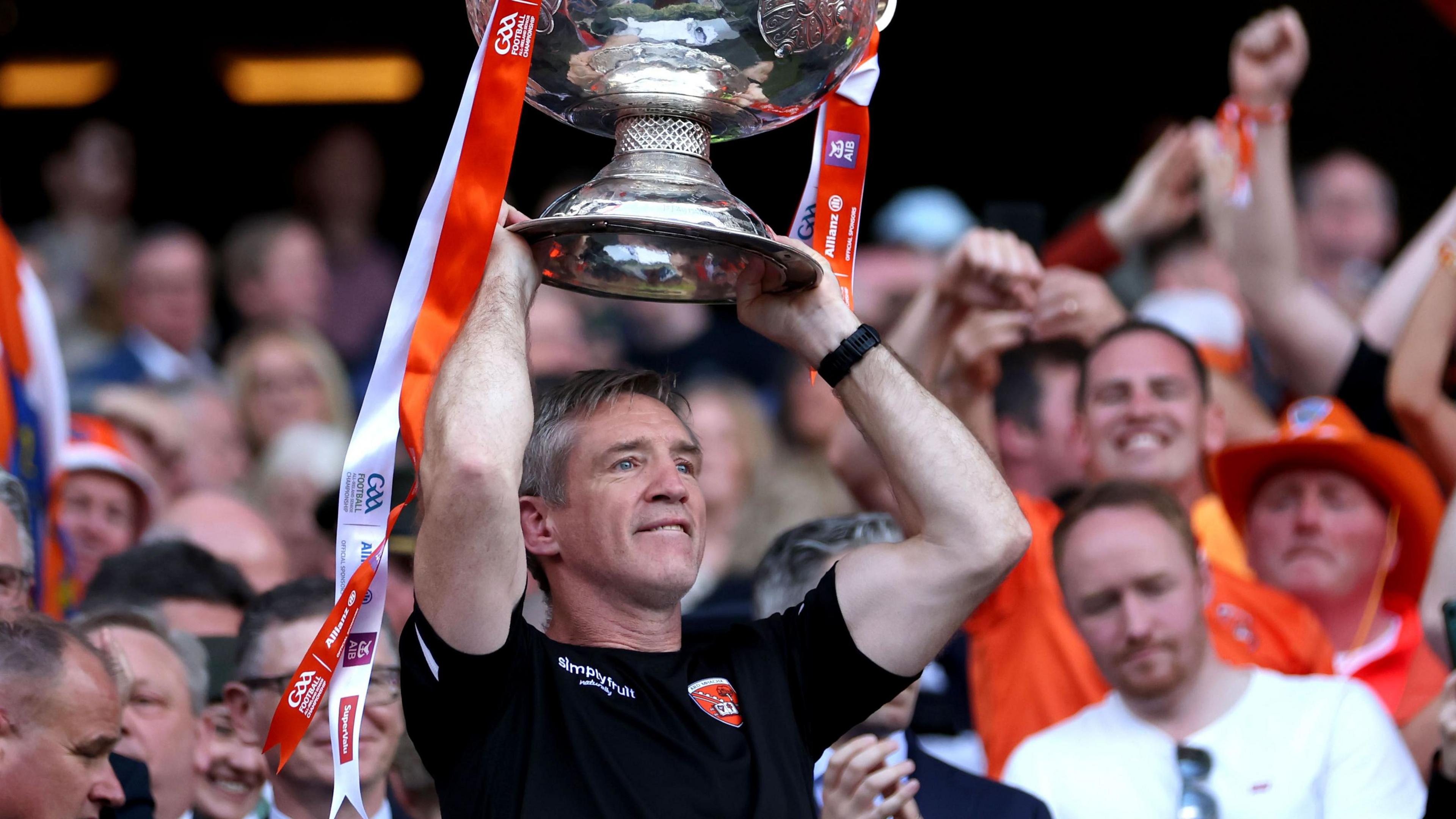 Kieran McGeeney lifts the Sam Maguire trophy