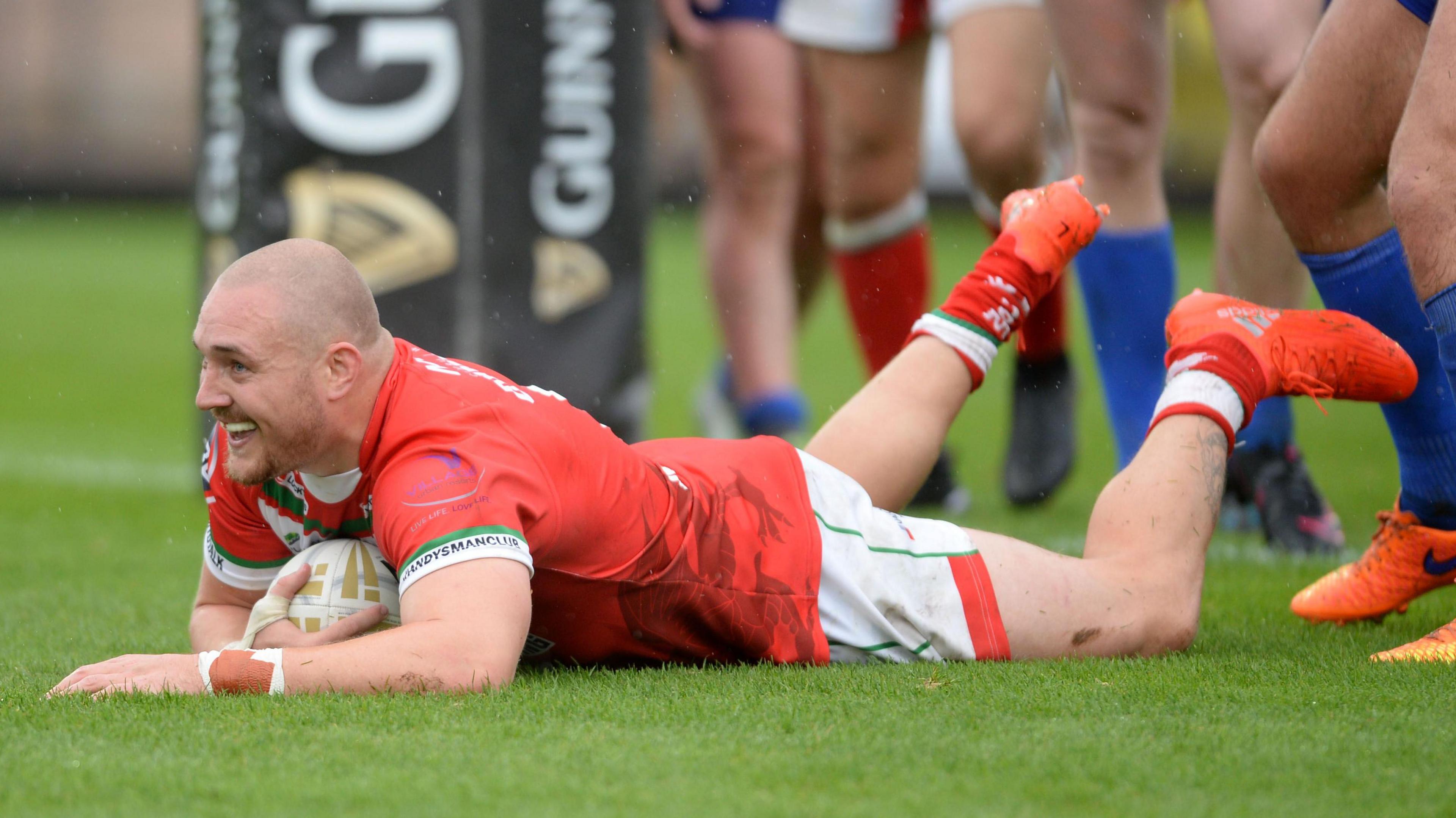 Gil Dudson scores a try for Wales against Serbia in 2013