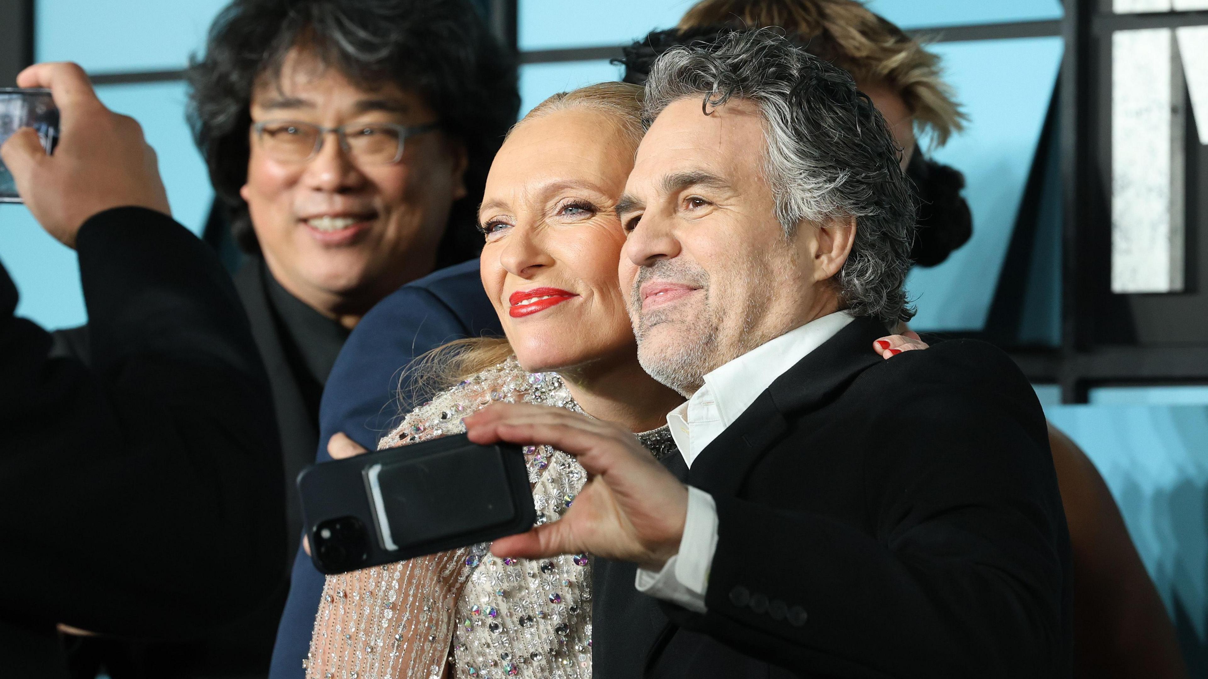 Bong Joon-ho, Toni Collette and Mark Ruffalo attend the "Mickey 17" World Premiere at Cineworld Leicester Square on February 13, 2025 in London, England.