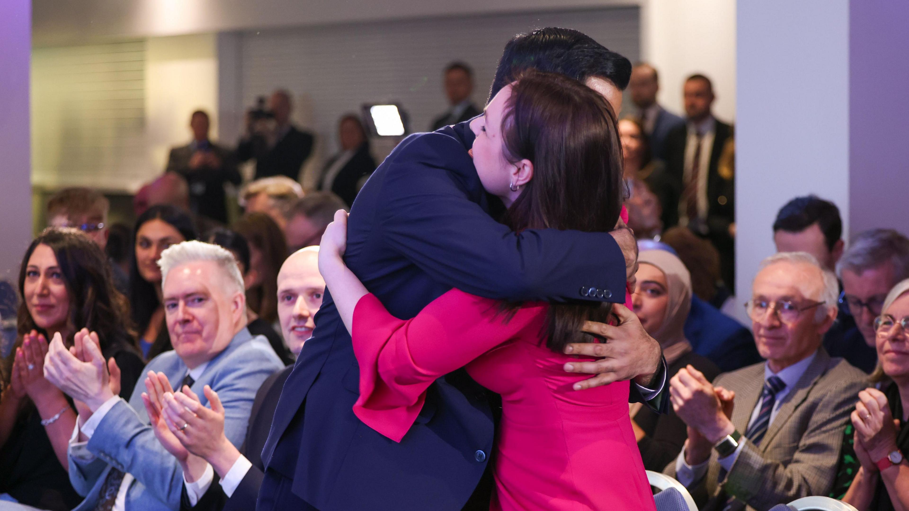 Humza Yousaf hugs Kate Forbes after being announced as the new leader of the Scottish National Party (SNP) at Murrayfield stadium in Edinburgh