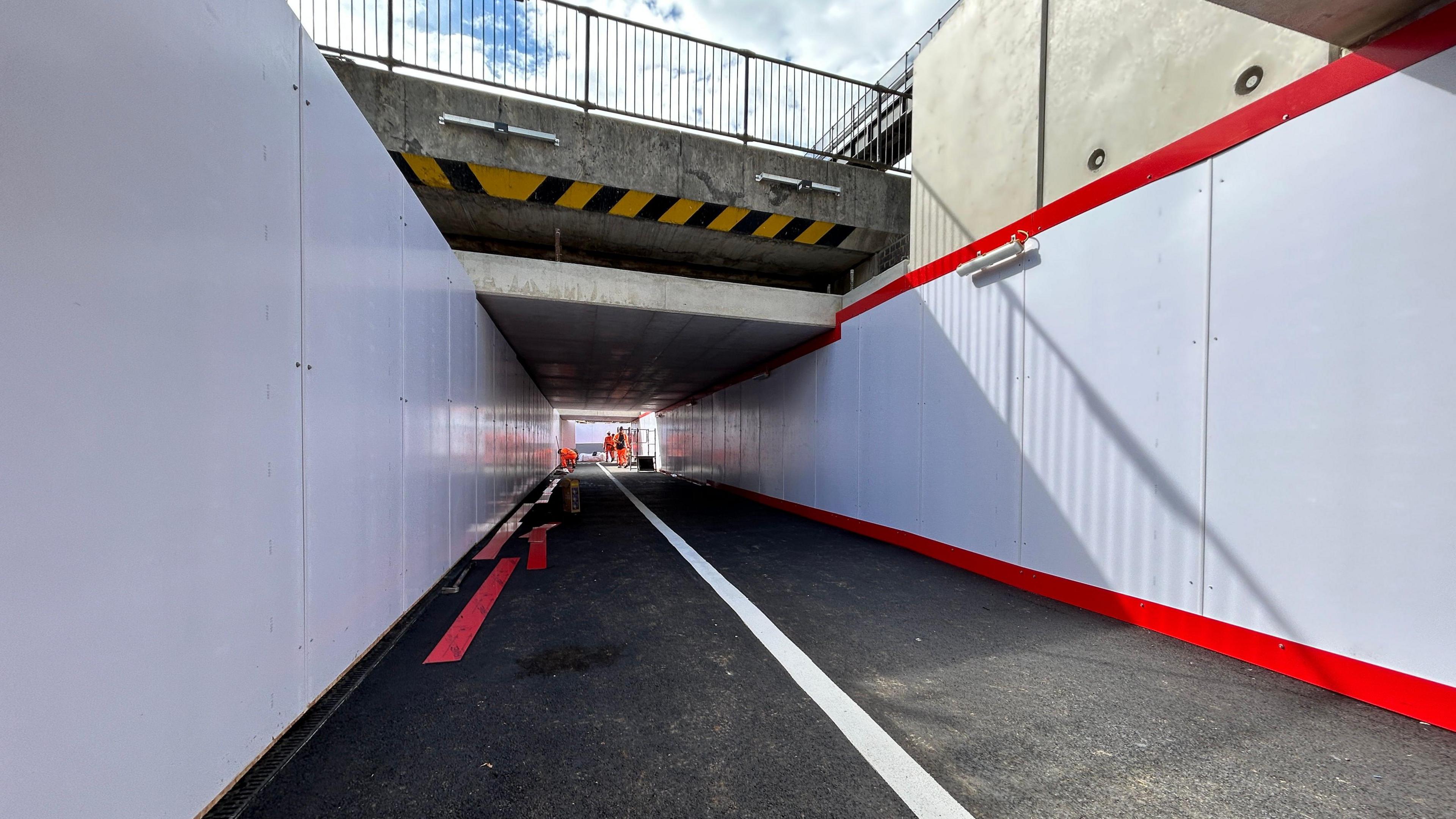 The improved walkway at Botley Road in Oxford, leading towards Botley Road. Some workers could be seen at the end of it.