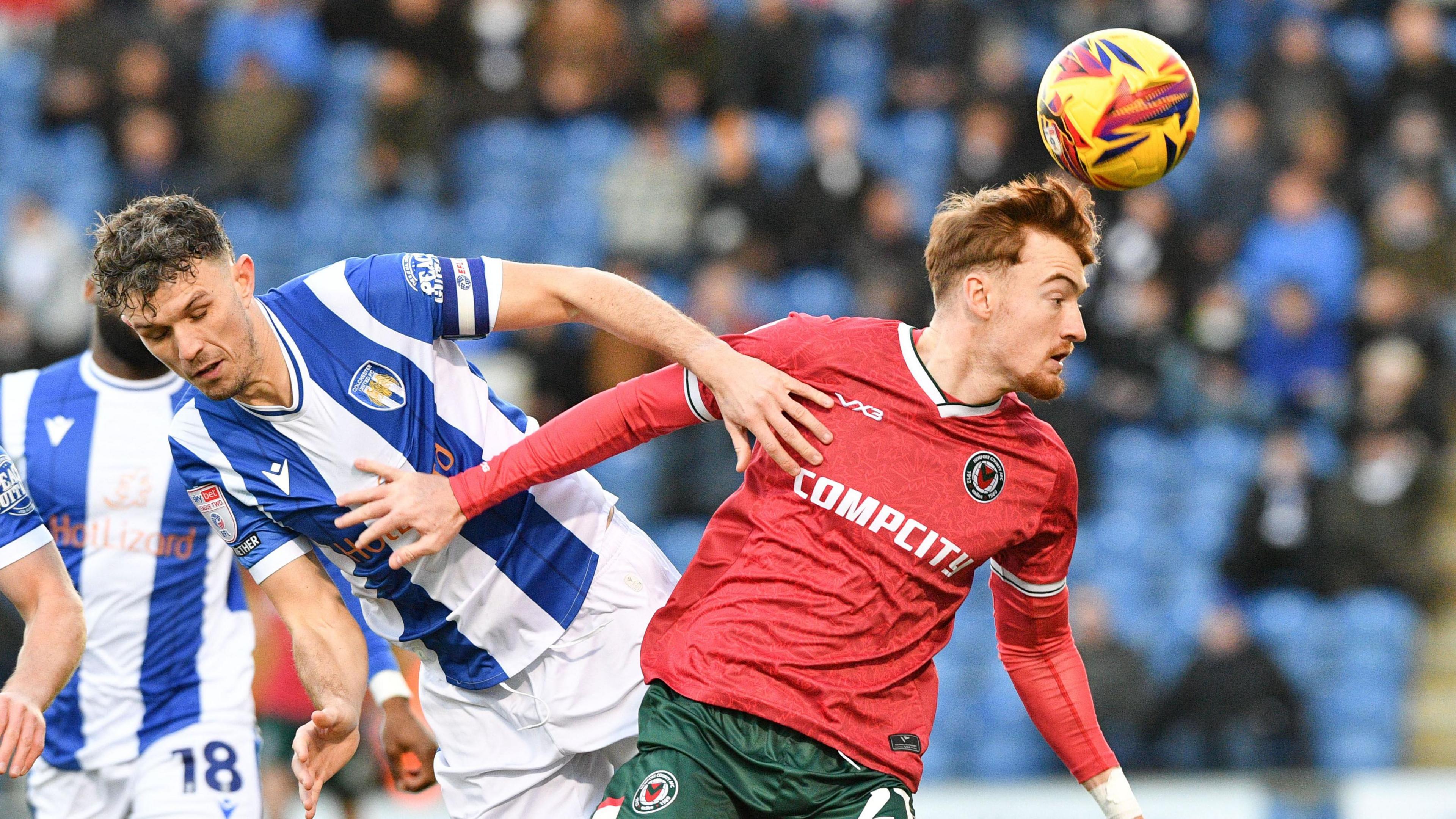 Michael Spellman of Newport County heads the ball