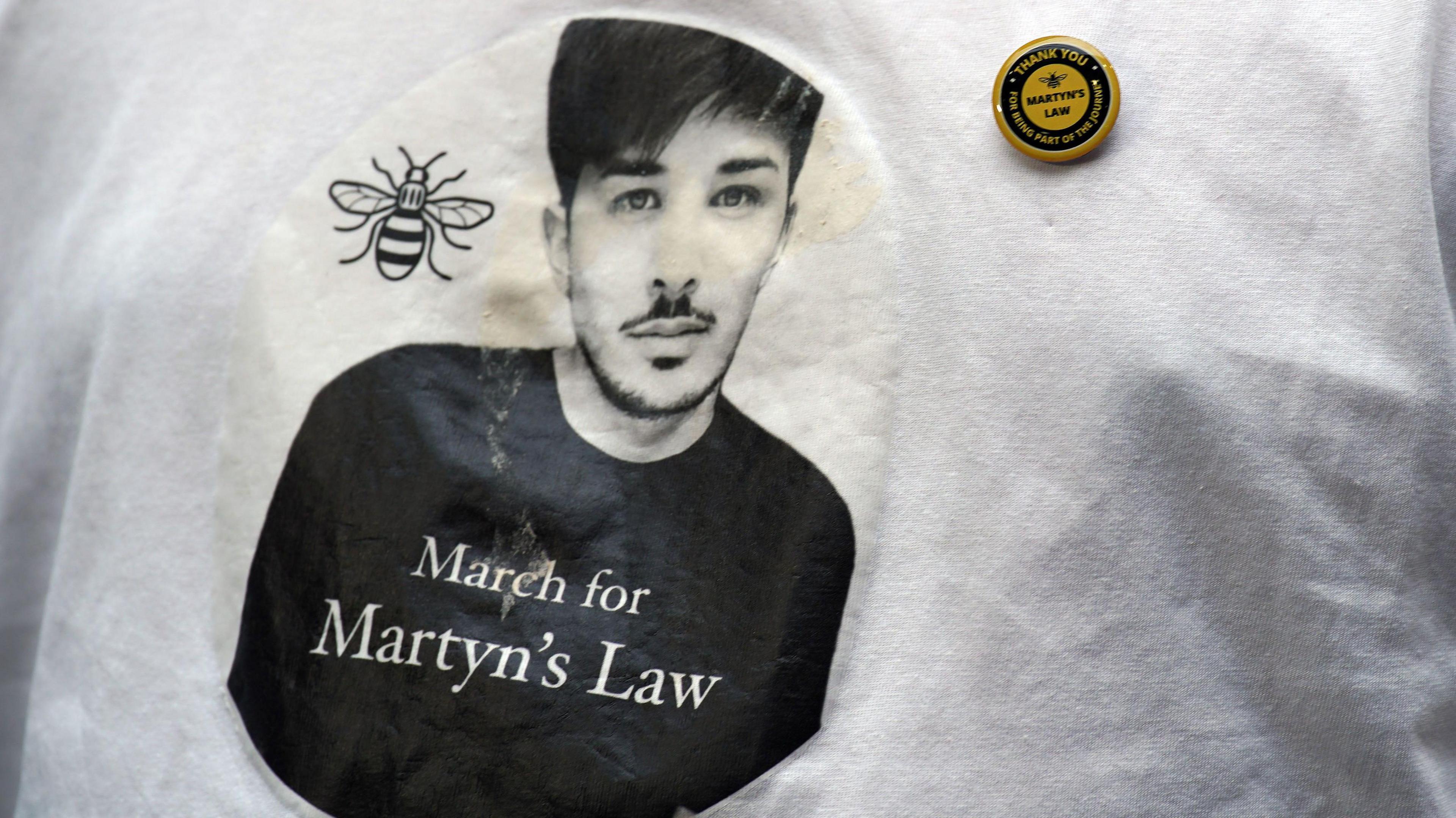 The image of Martyn Hett, a victim of the Manchester Arena bombing, on a T-shirt.