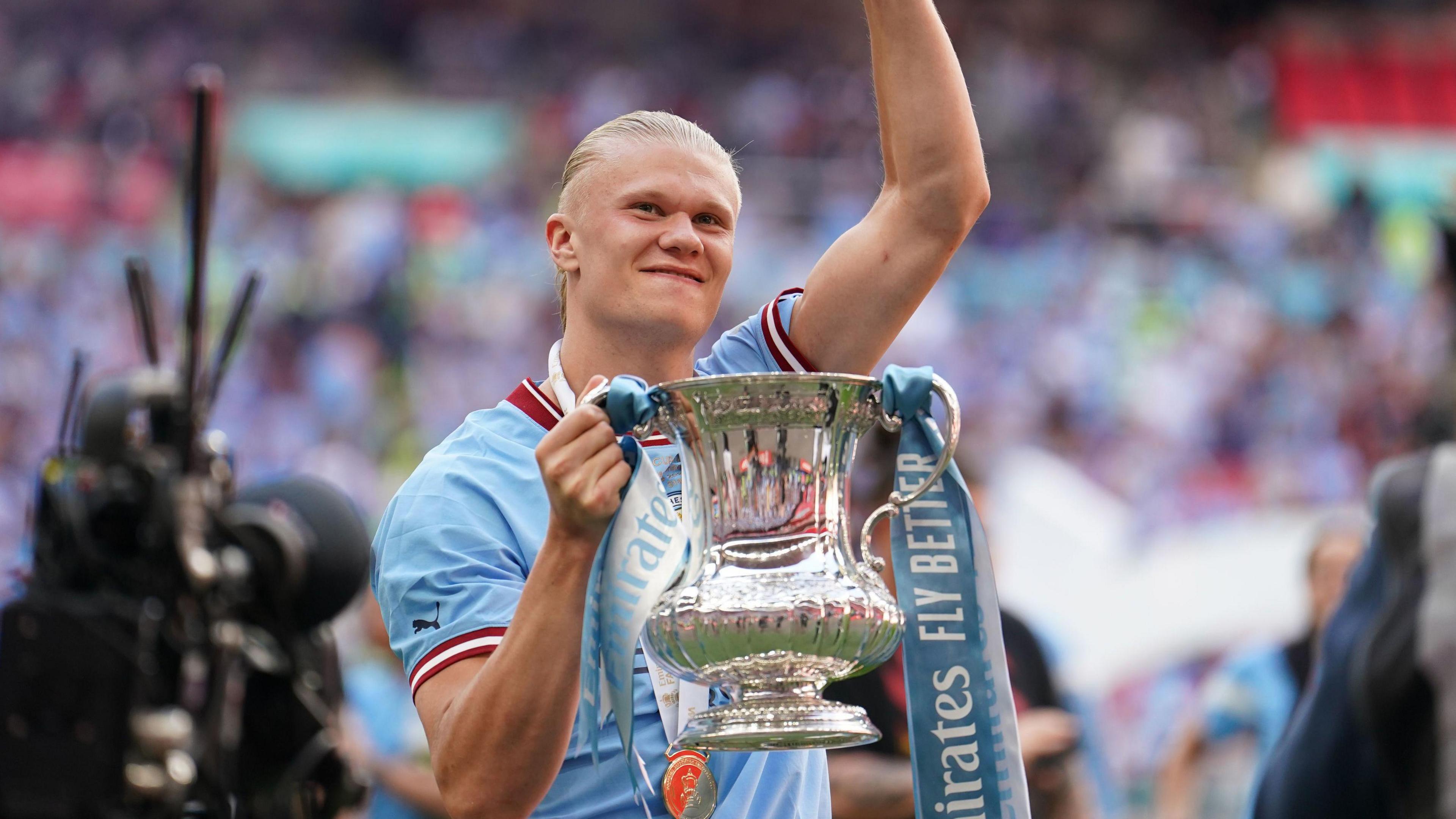 Erling Haaland with the FA Cup trophy in 2023