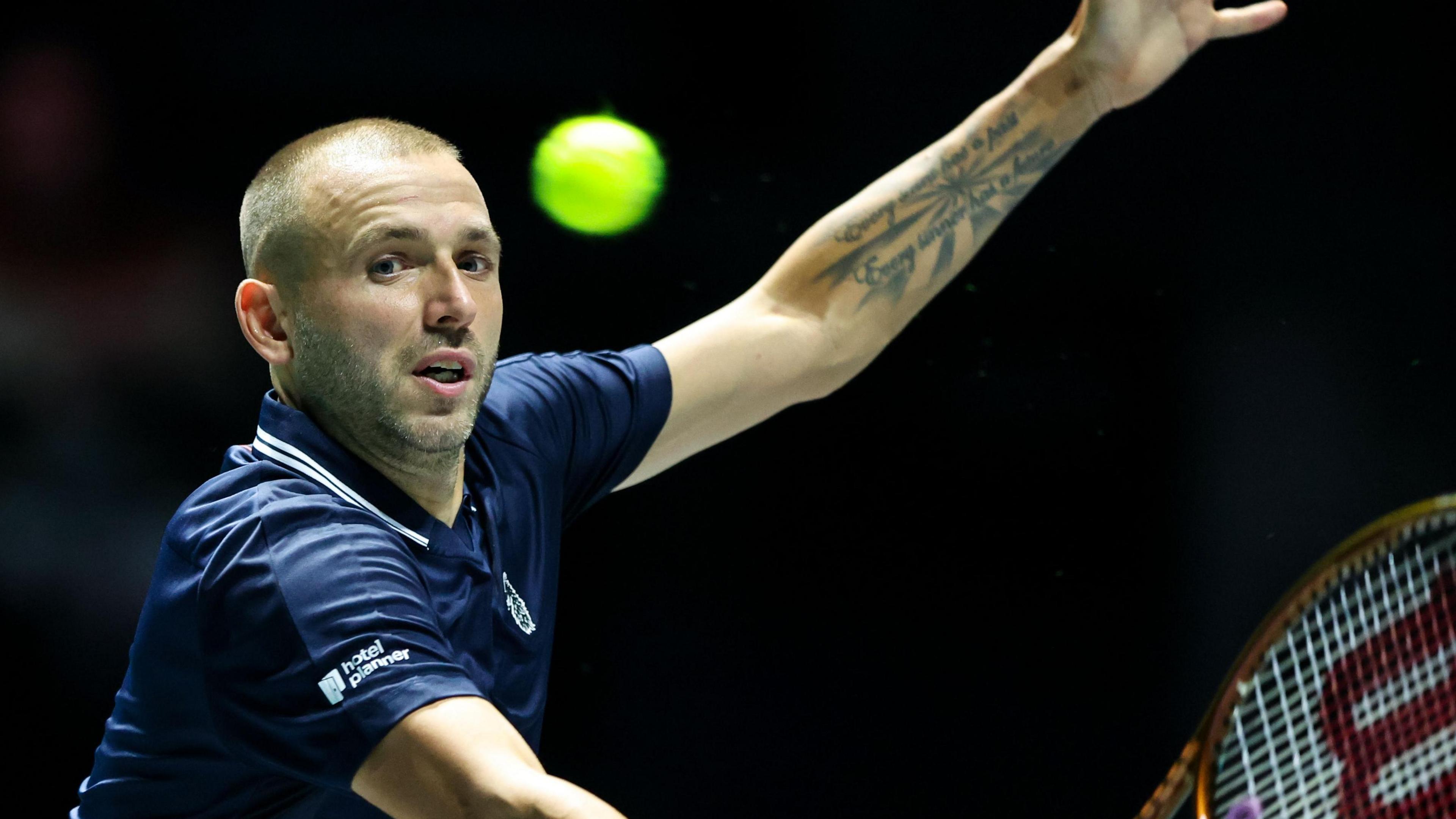 Dan Evans stretches for a ball during Great Britain's Davis Cup tie in Manchester in September 2024