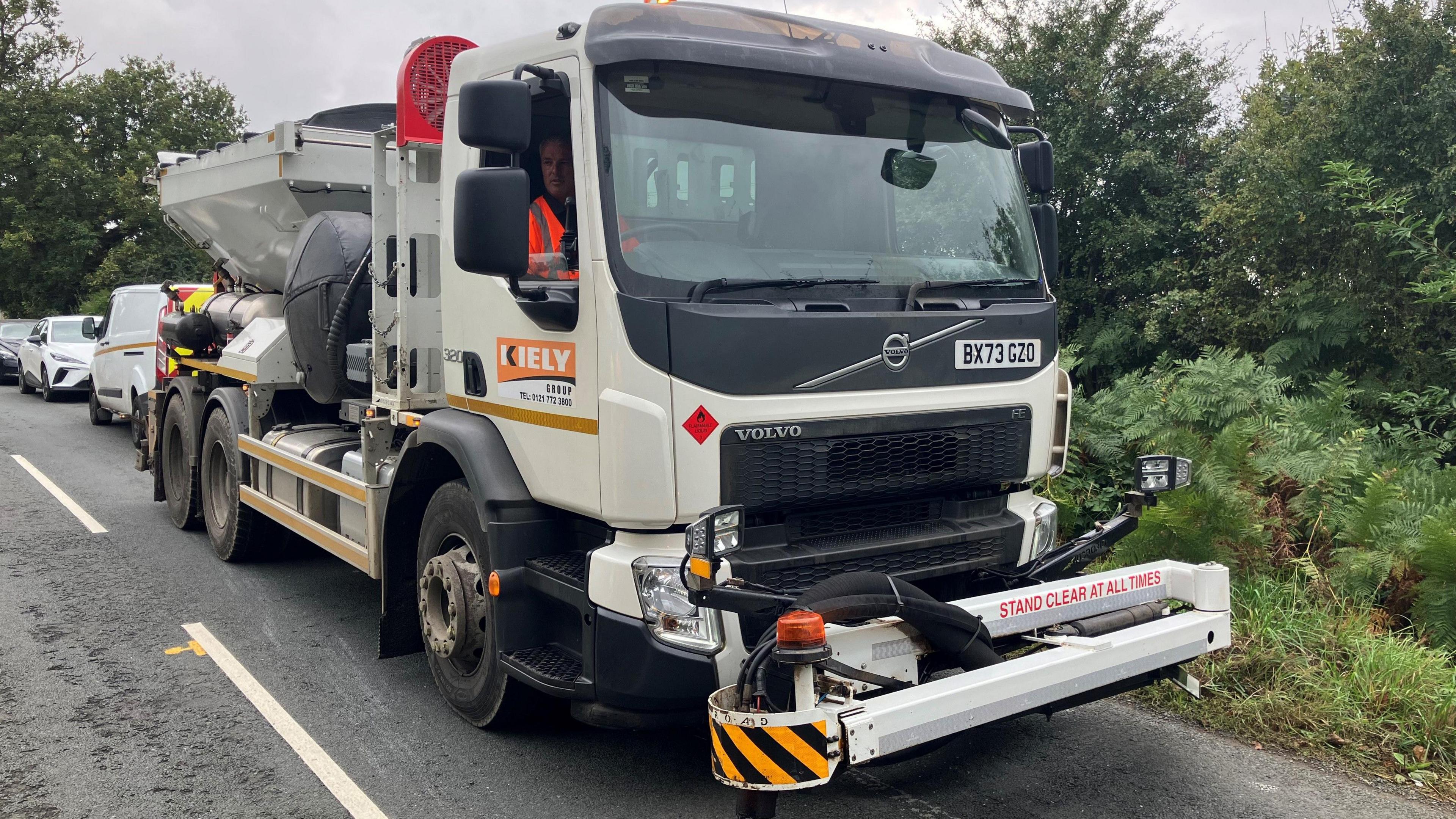 The pothole machine parked on a road 