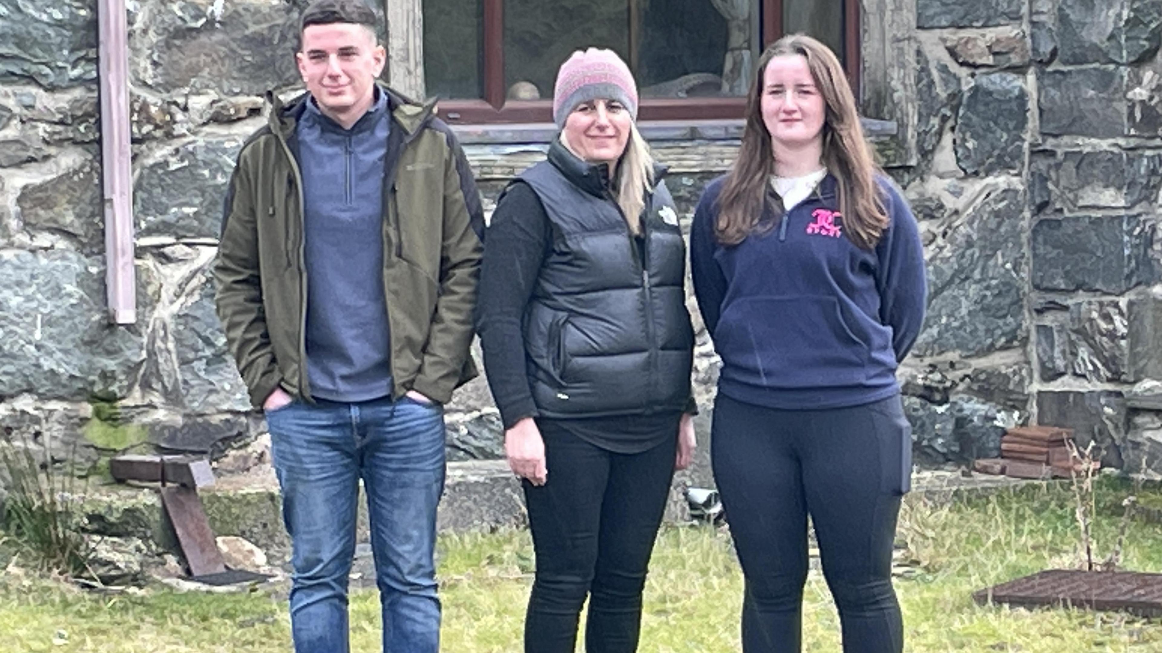 Elis Morris, mother Eira Morris, and her Elis' sister Beca outside Hafodty farmhouse on the slopes of Snowdon