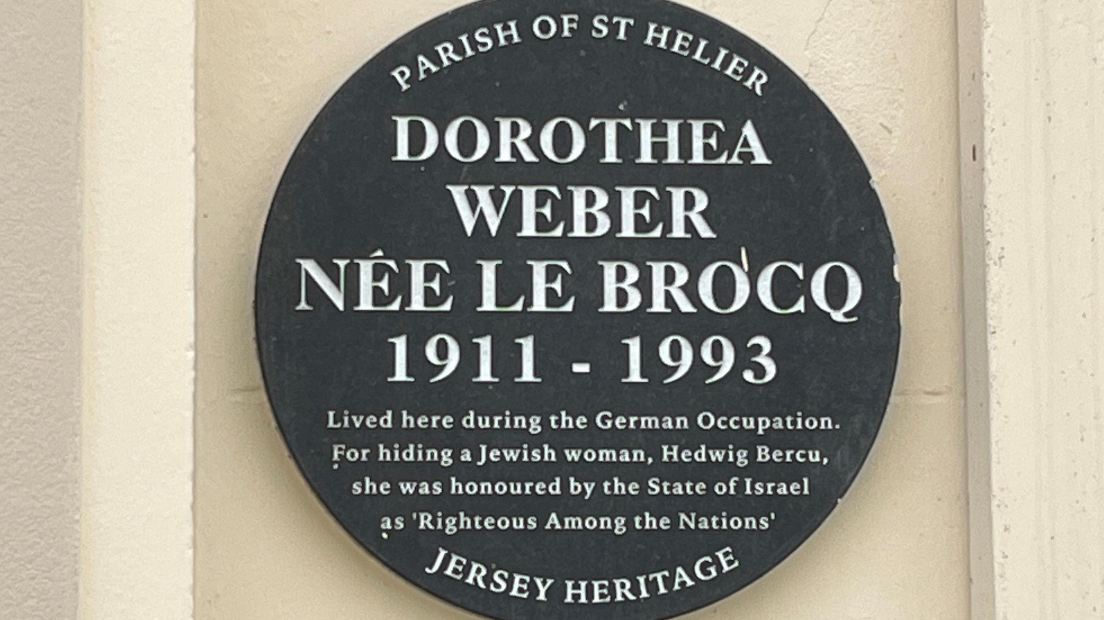 A Jersey Heritage wall plaque remembering Dorothea Webber who loves from 1911 to 1993 who hid Jewish woman Hedwig Bercu in her home and was honoured by the State Of Israel