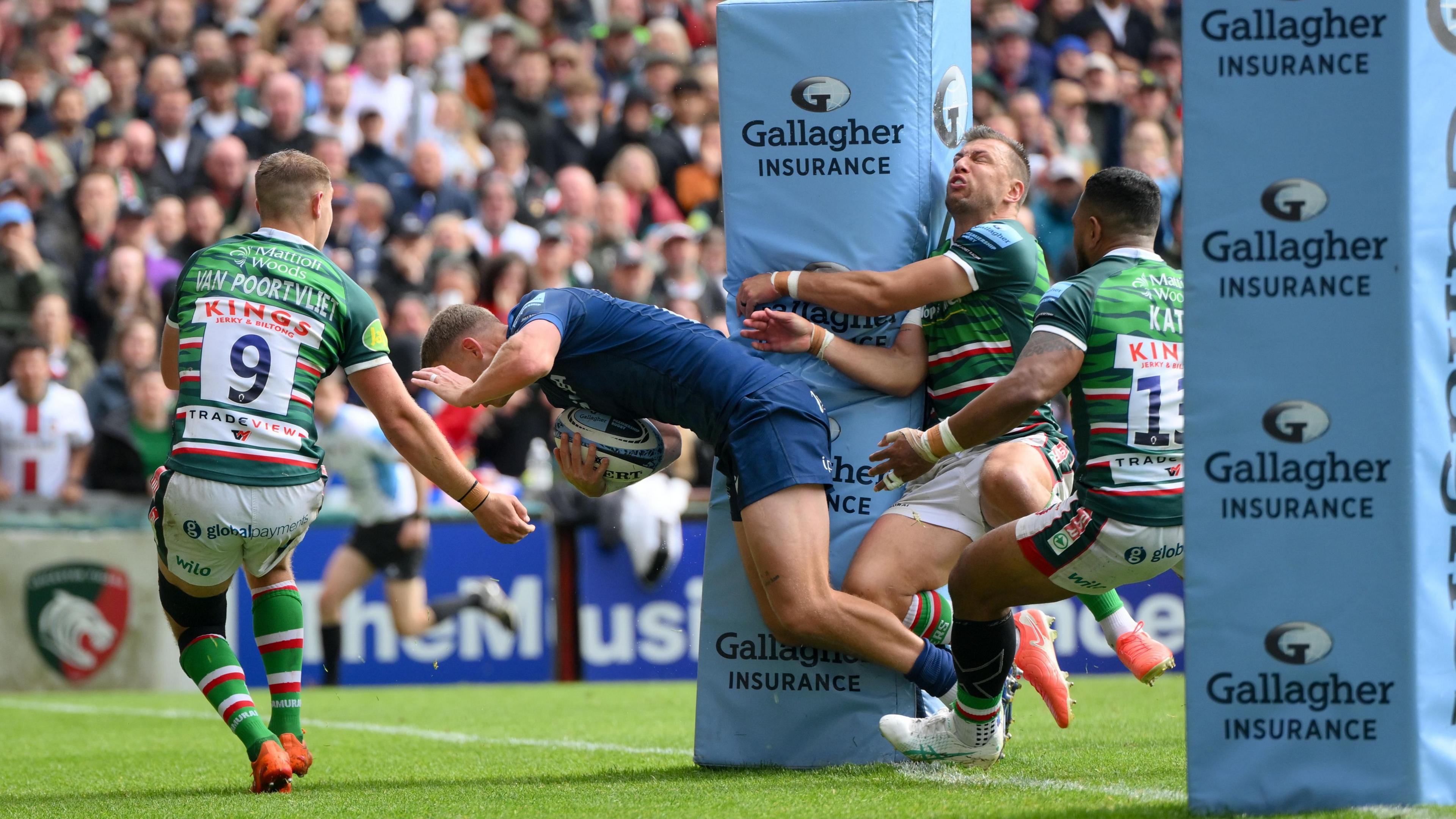 Rob du Preez goes over for Sale's try as Tigers fly-half Handre Pollard collides with the post