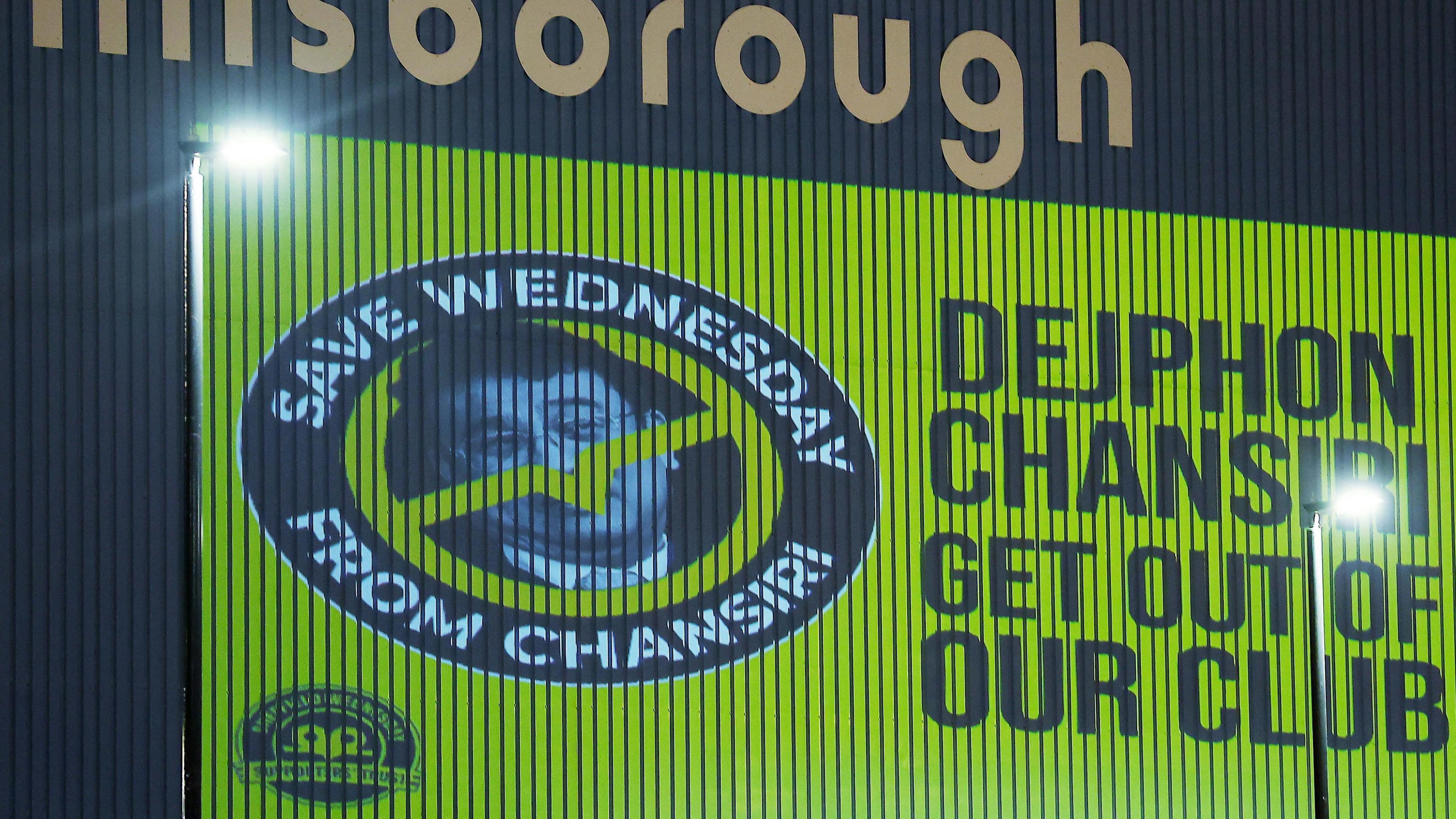 An image of former Sheffield Wednesday owner Dejphon Chansiri projected onto the side of Hillsborough by fans calling for him to go