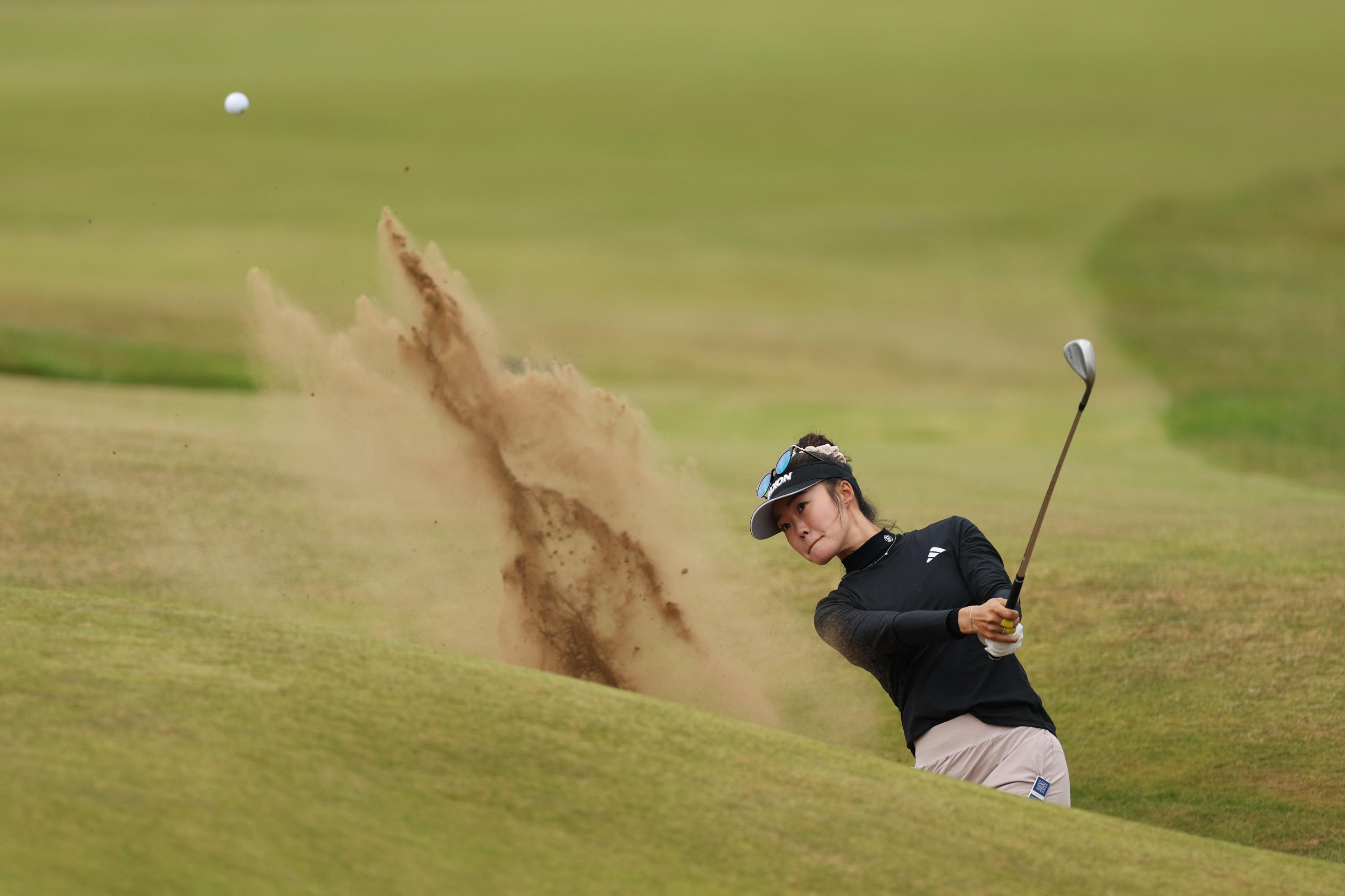 Australia's Grace Kim plays a bunker shot on the 18th hole during the third round of the AIG Women's Open 2025 at Royal Porthcawl Golf Club in Bridgend, Wales. Photo by Richard Heathcote
