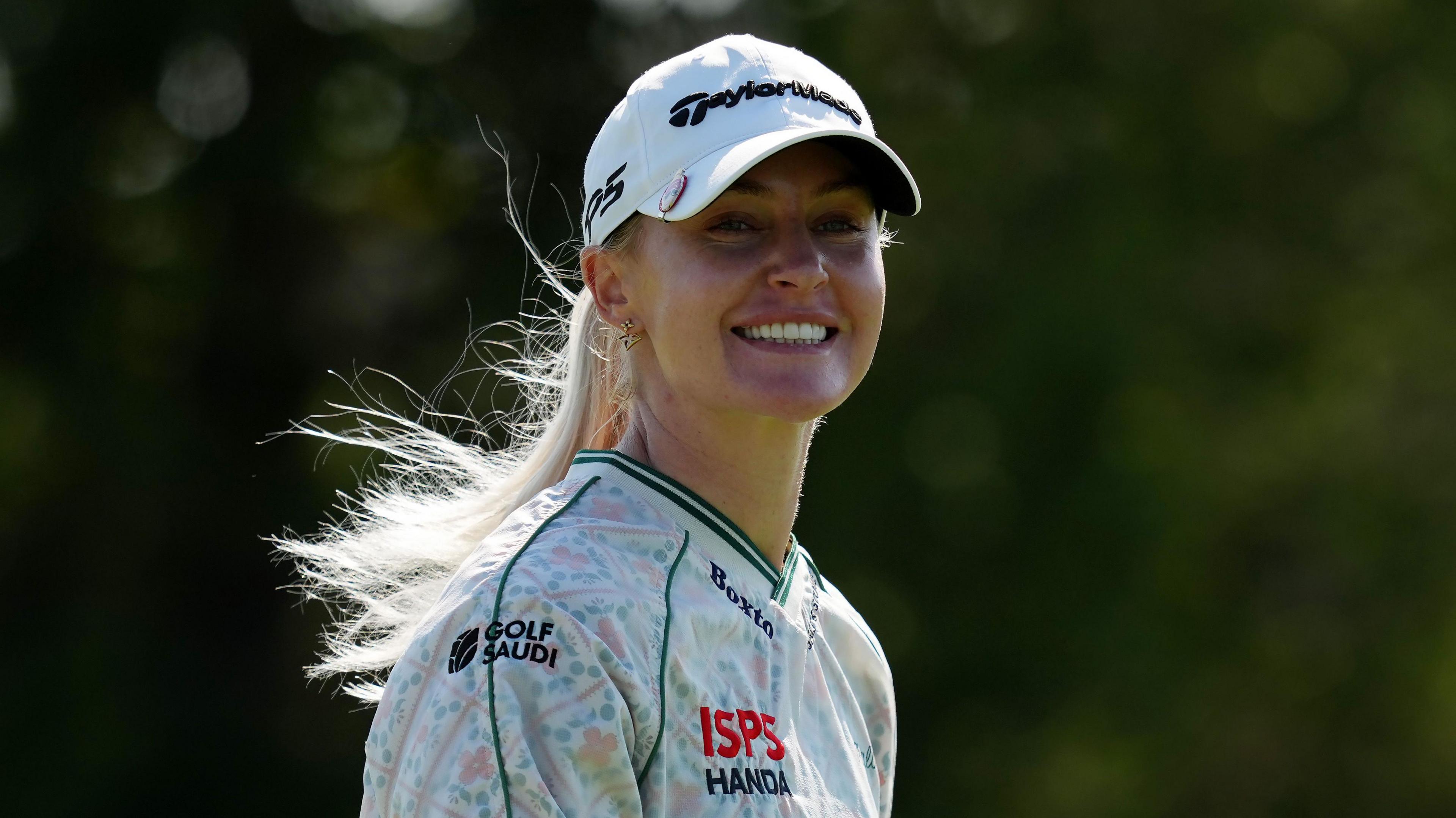 England's Charley Hull smiles during the third round of the Queen City Championship in Ohio
