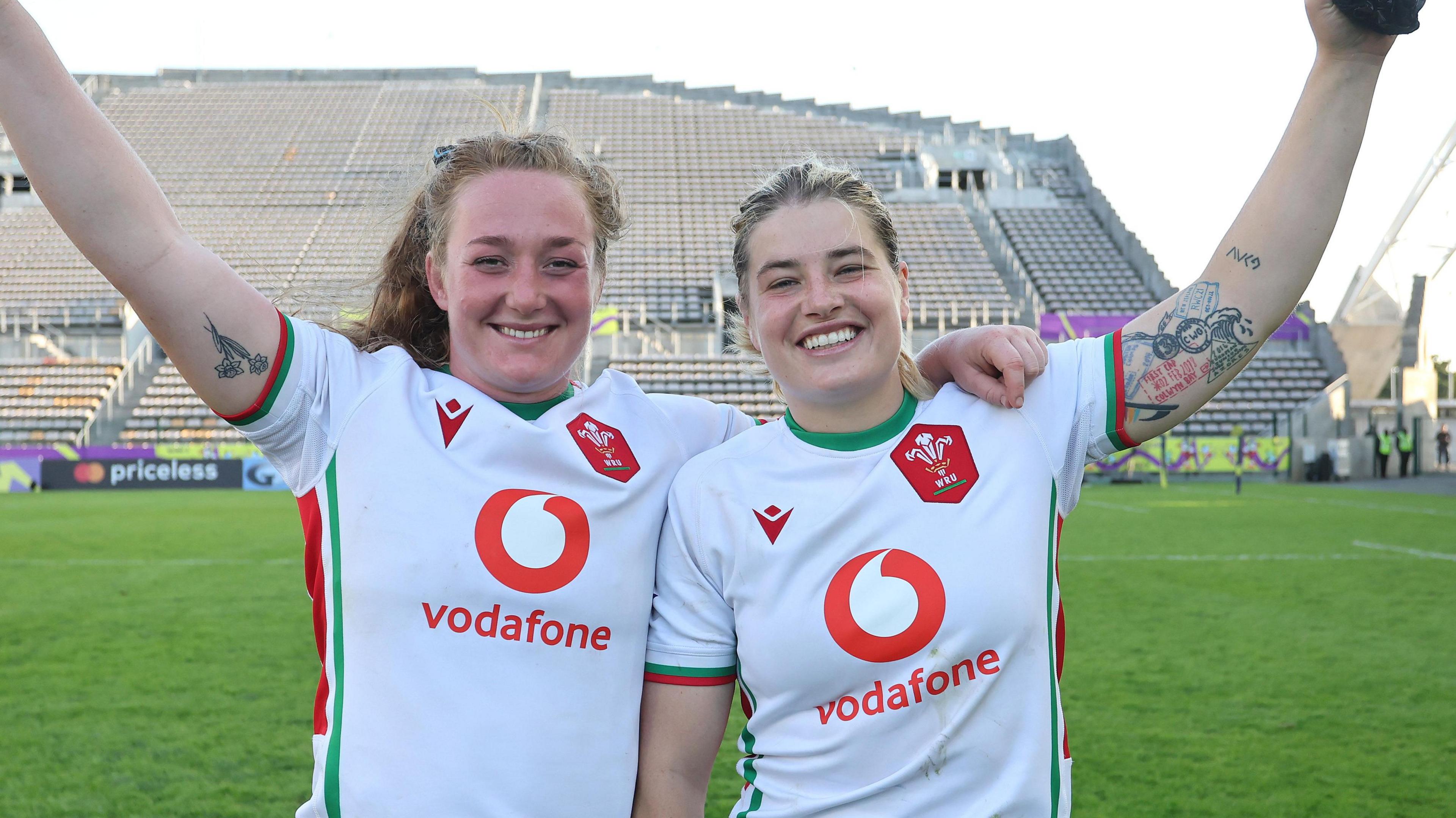 Abbie Fleming and Bethan Lewis with their arms around each other after a match