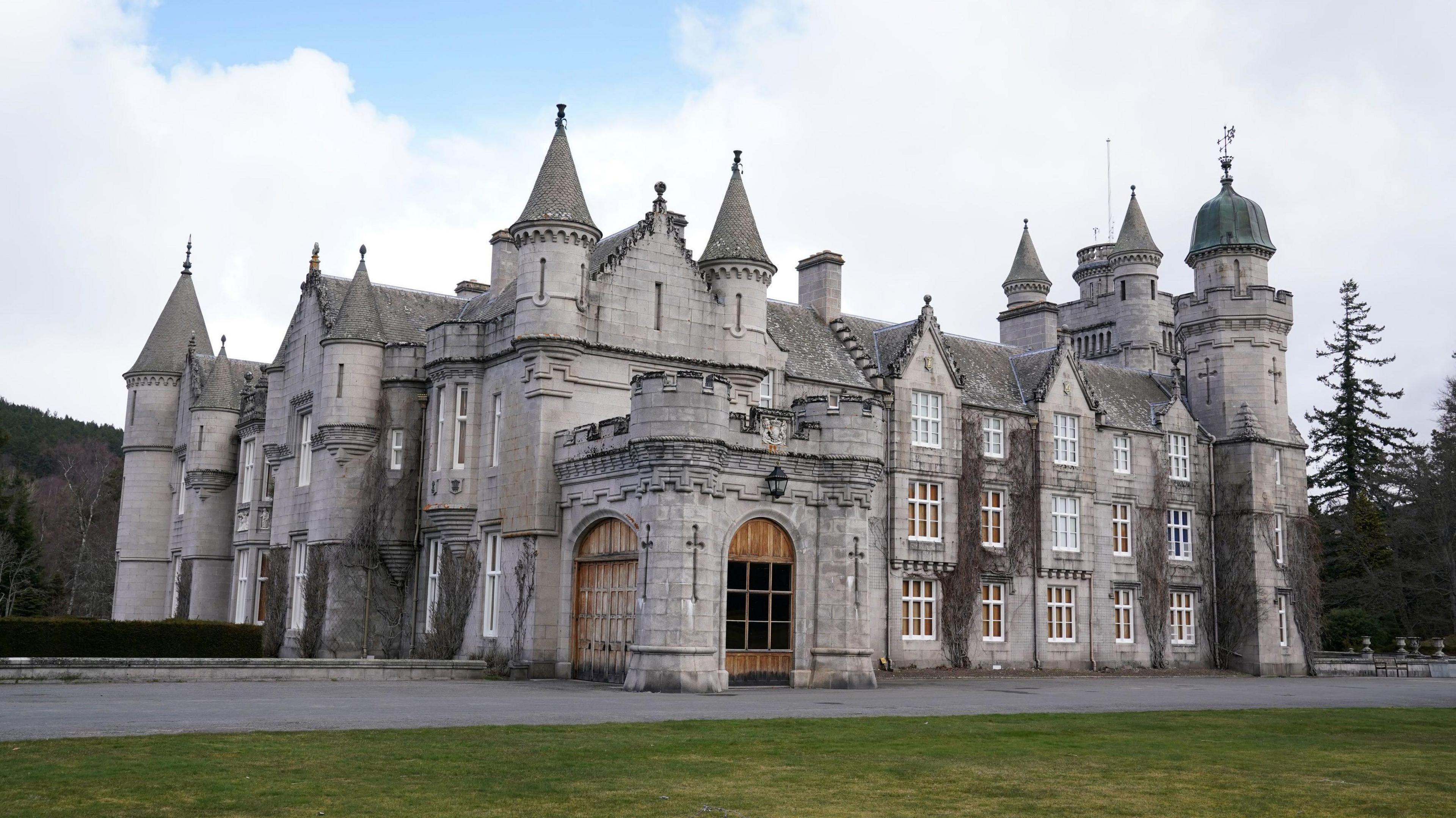 The front of the main Royal castle on the Balmoral estate, with several turrets