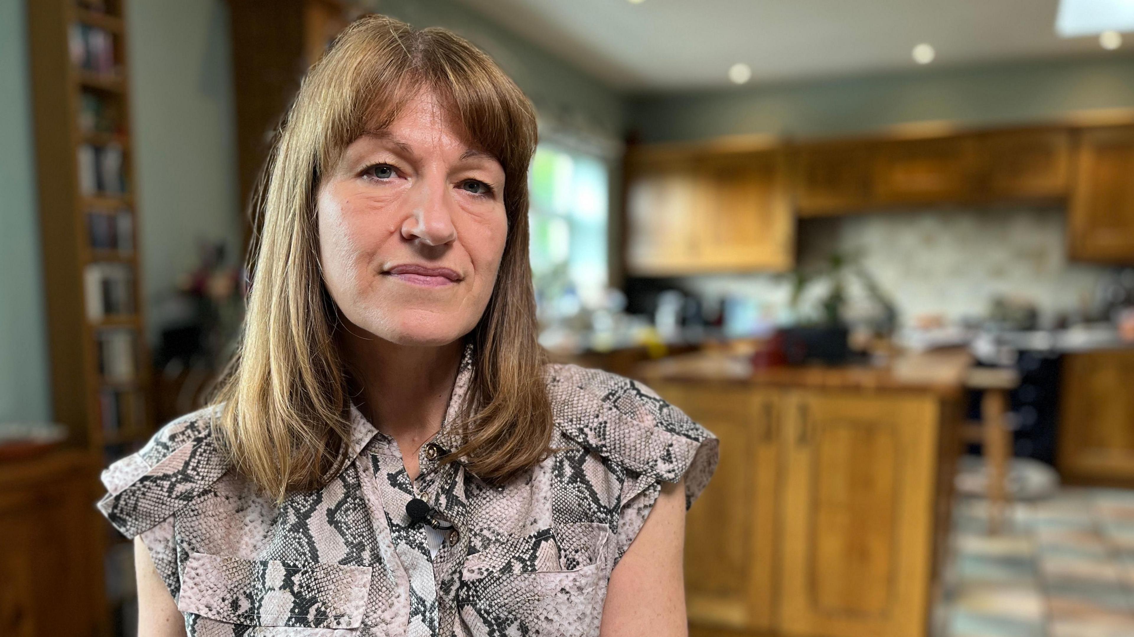 Photo of Christine Wadsworth in her kitchen