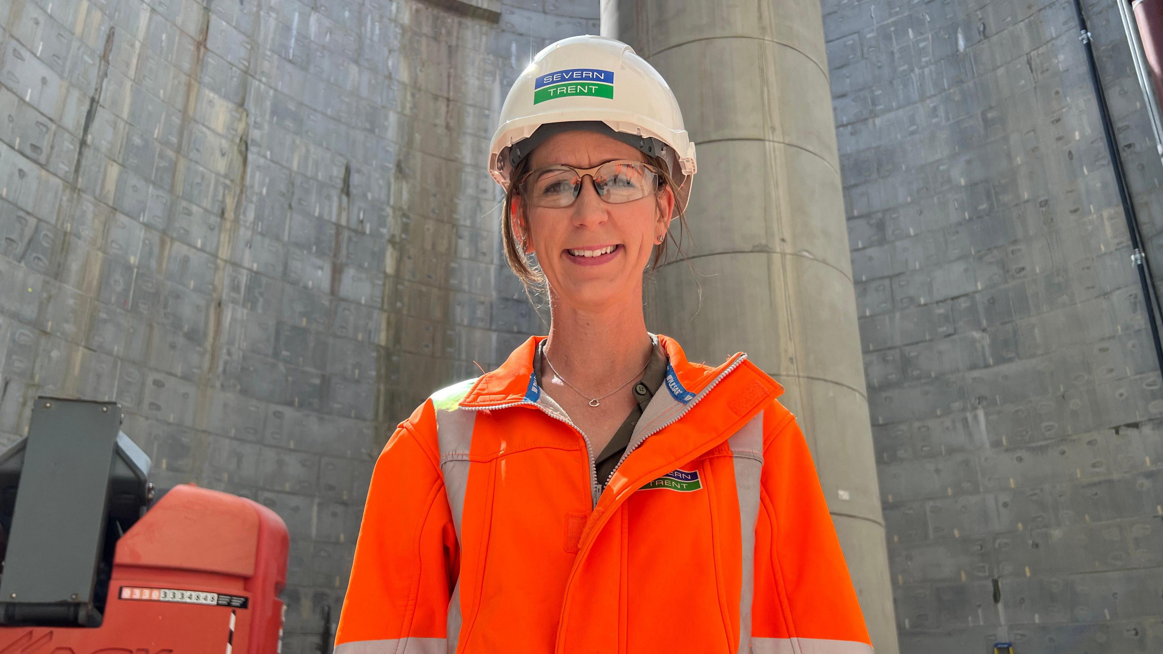 Steph Cawley, Director of Operations, Severn Trent in a bright orange hi-vis jacket 