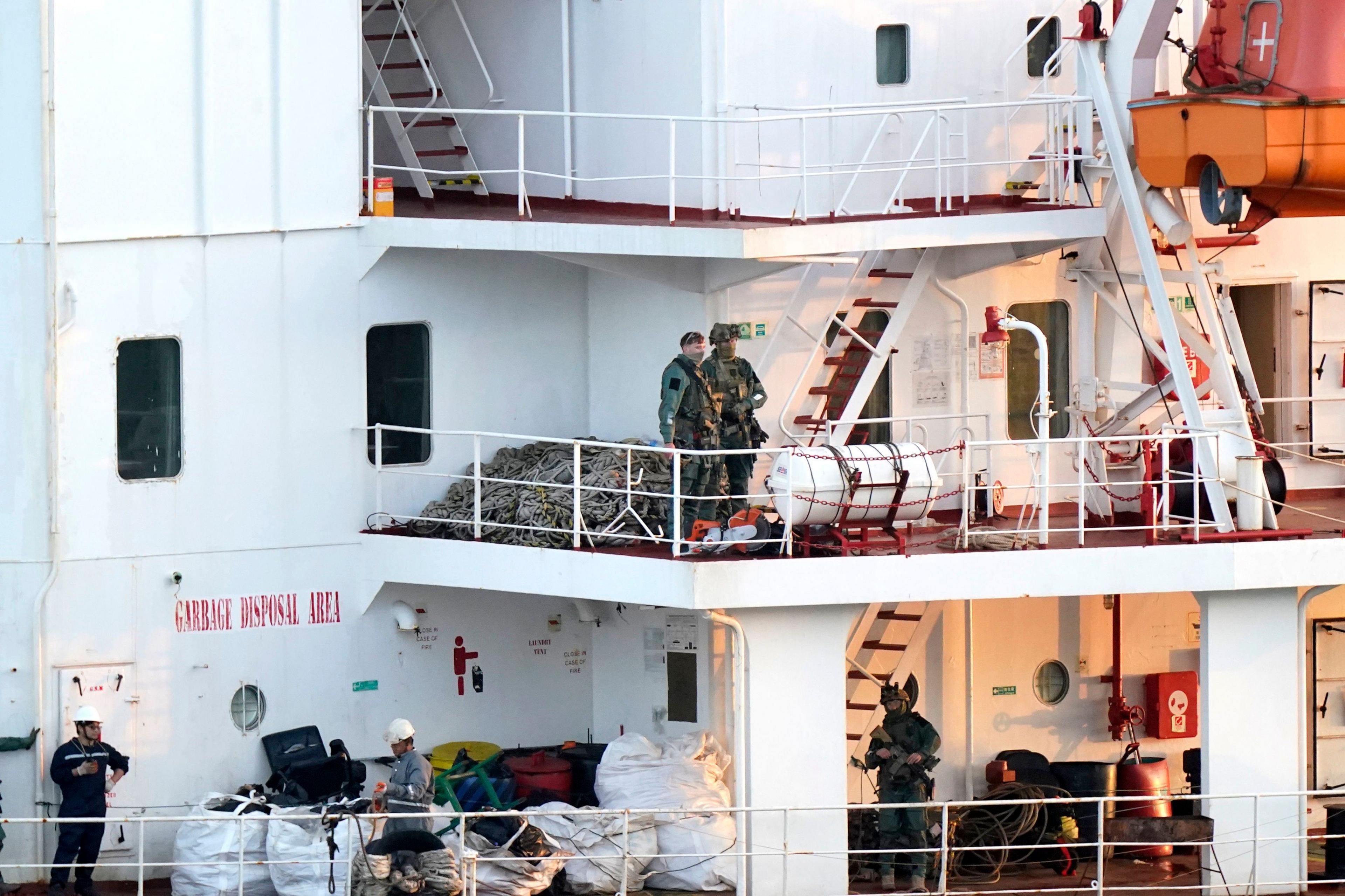 Army Rangers pictured onboard multiple levels of the MV Matthew, large white multi level decking area with ladders connecting them