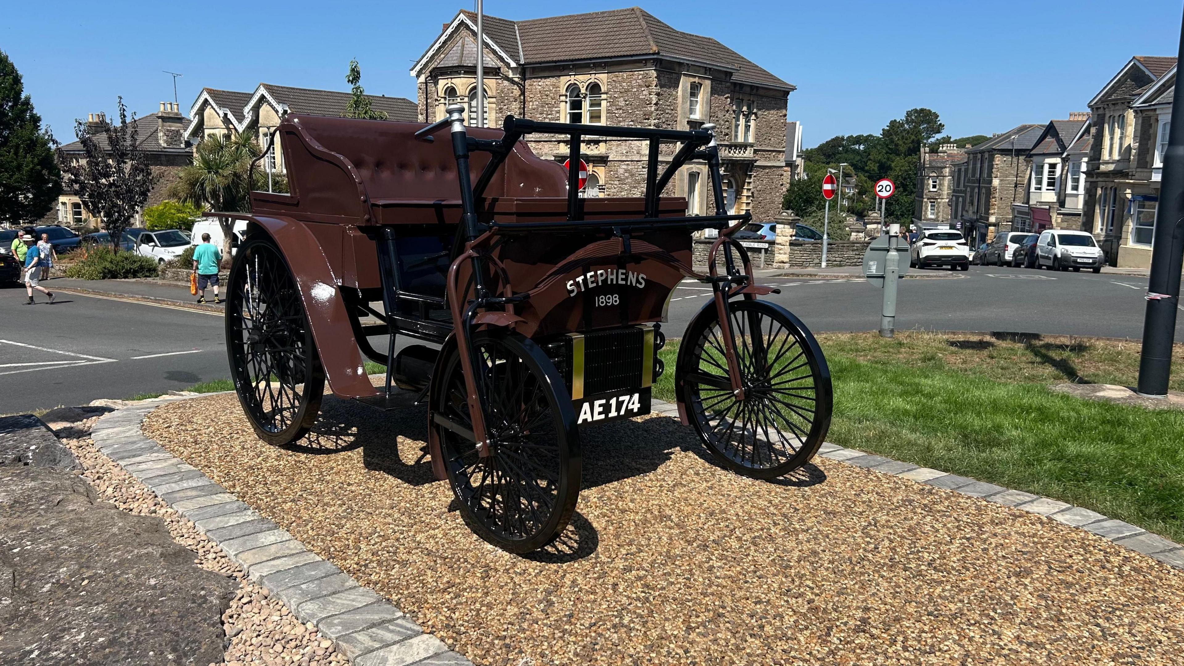 A metal model of the Stephens car, sitting on a roundabout