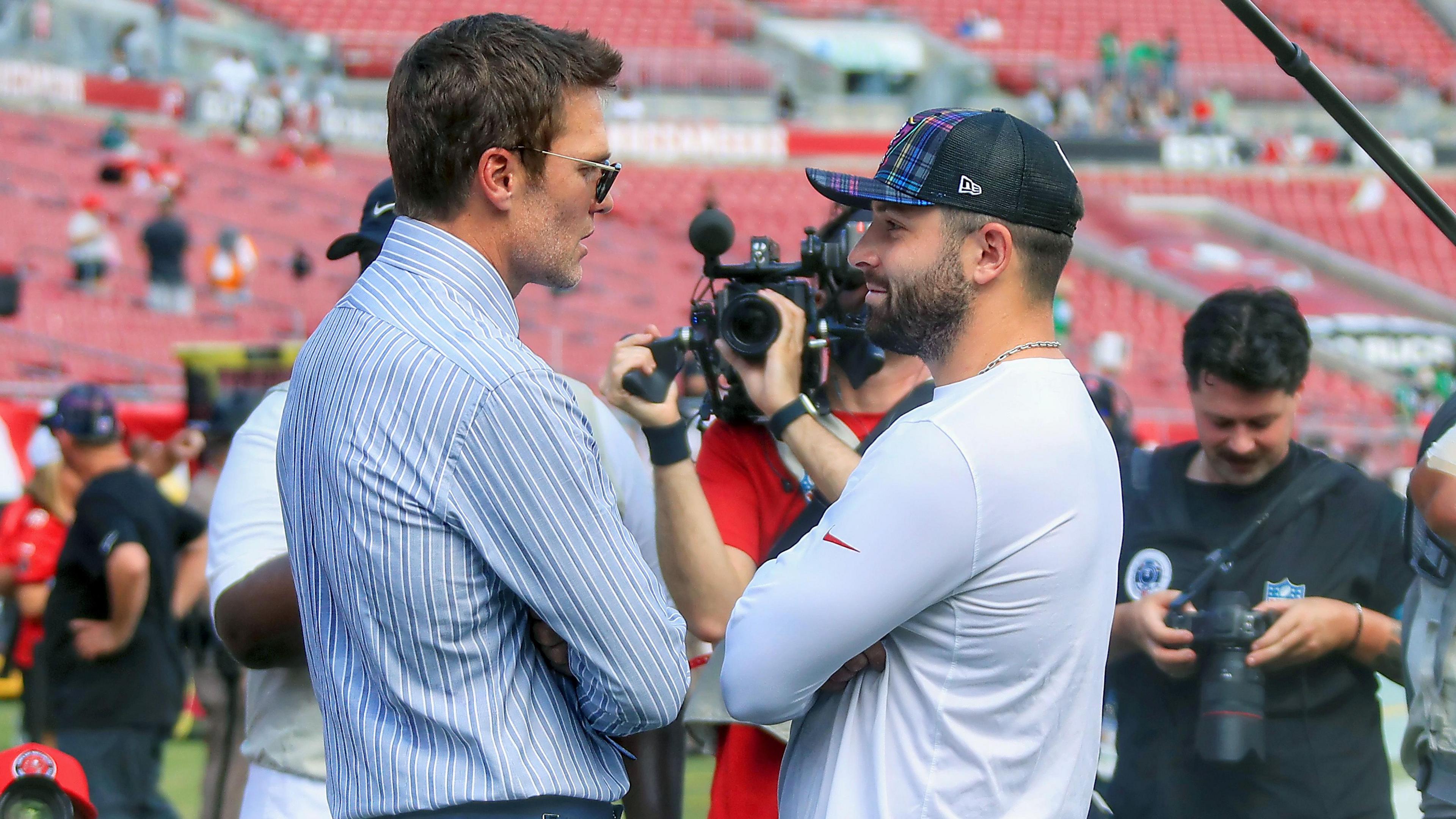 Tom Brady talks with Baker Mayfield before the Tampa Bay Buccaneers game begins