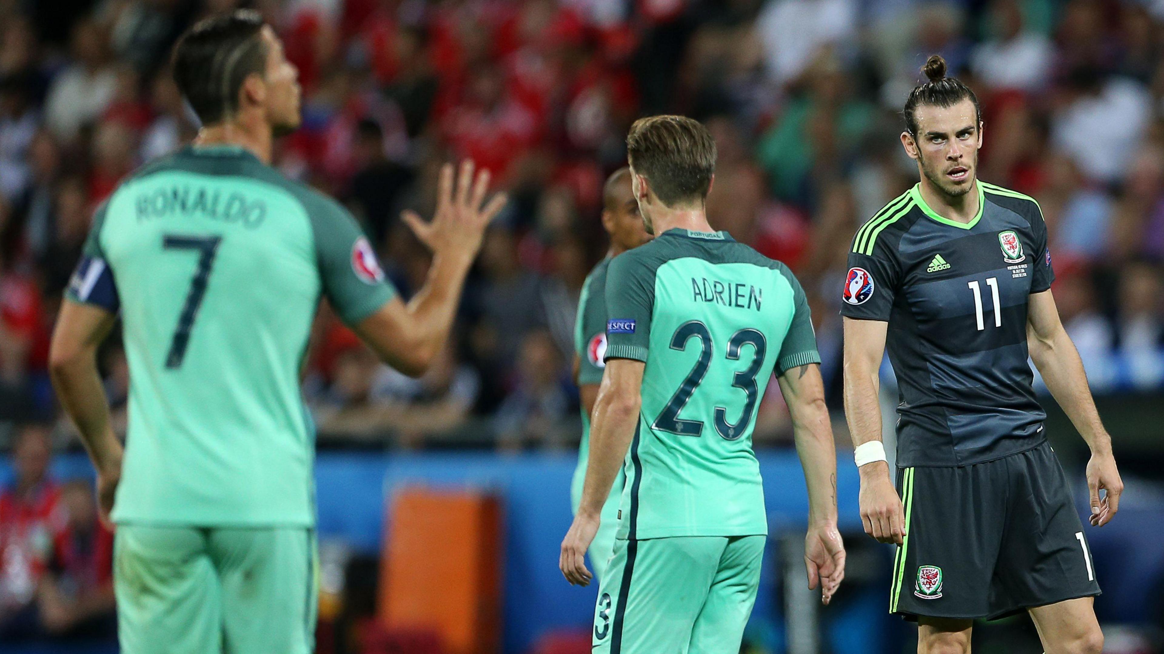 Cristiano Ronaldo gestures to a teammate as Gareth Bale looks on