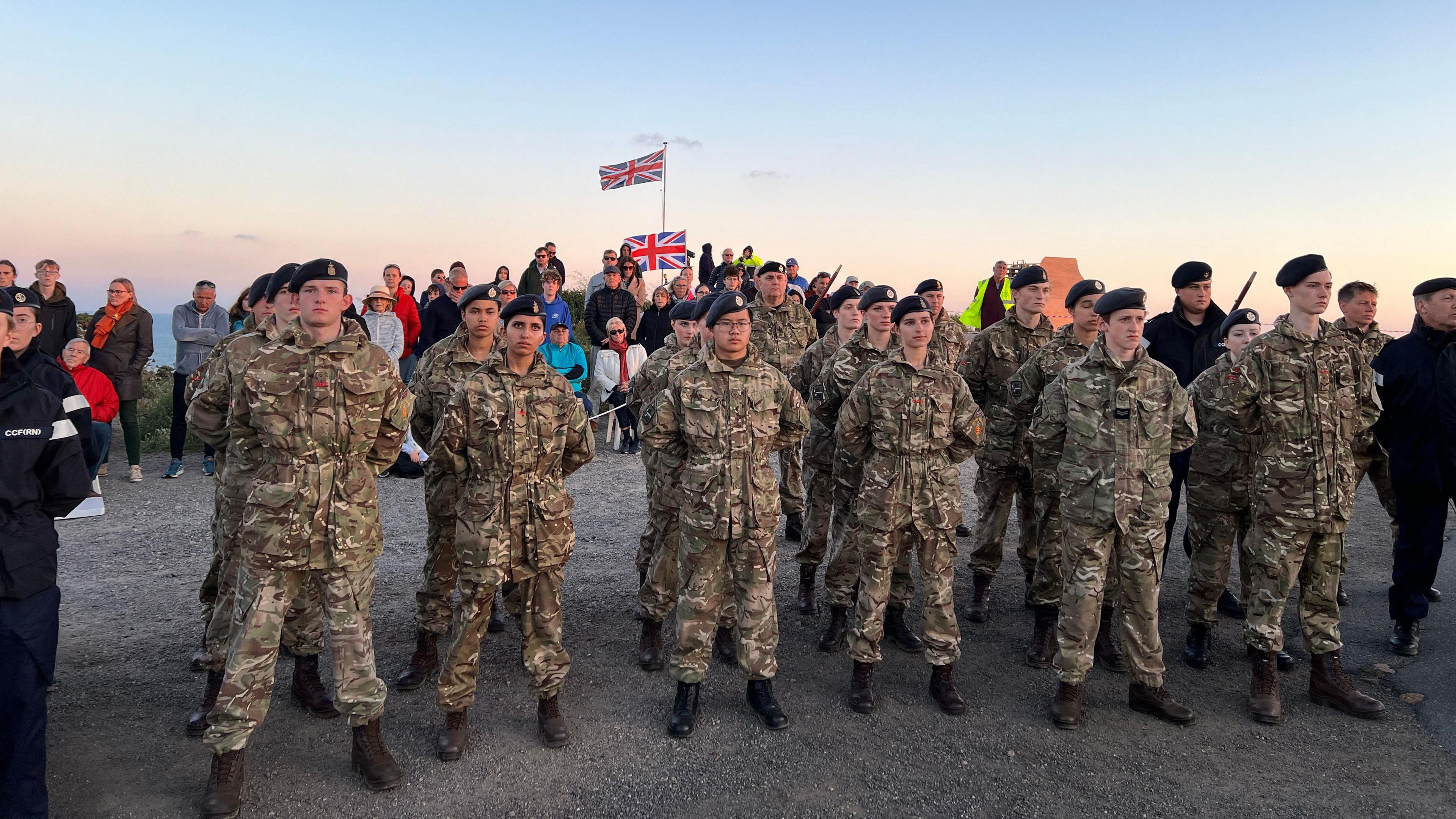 Soldiers and people at a beacon lighting