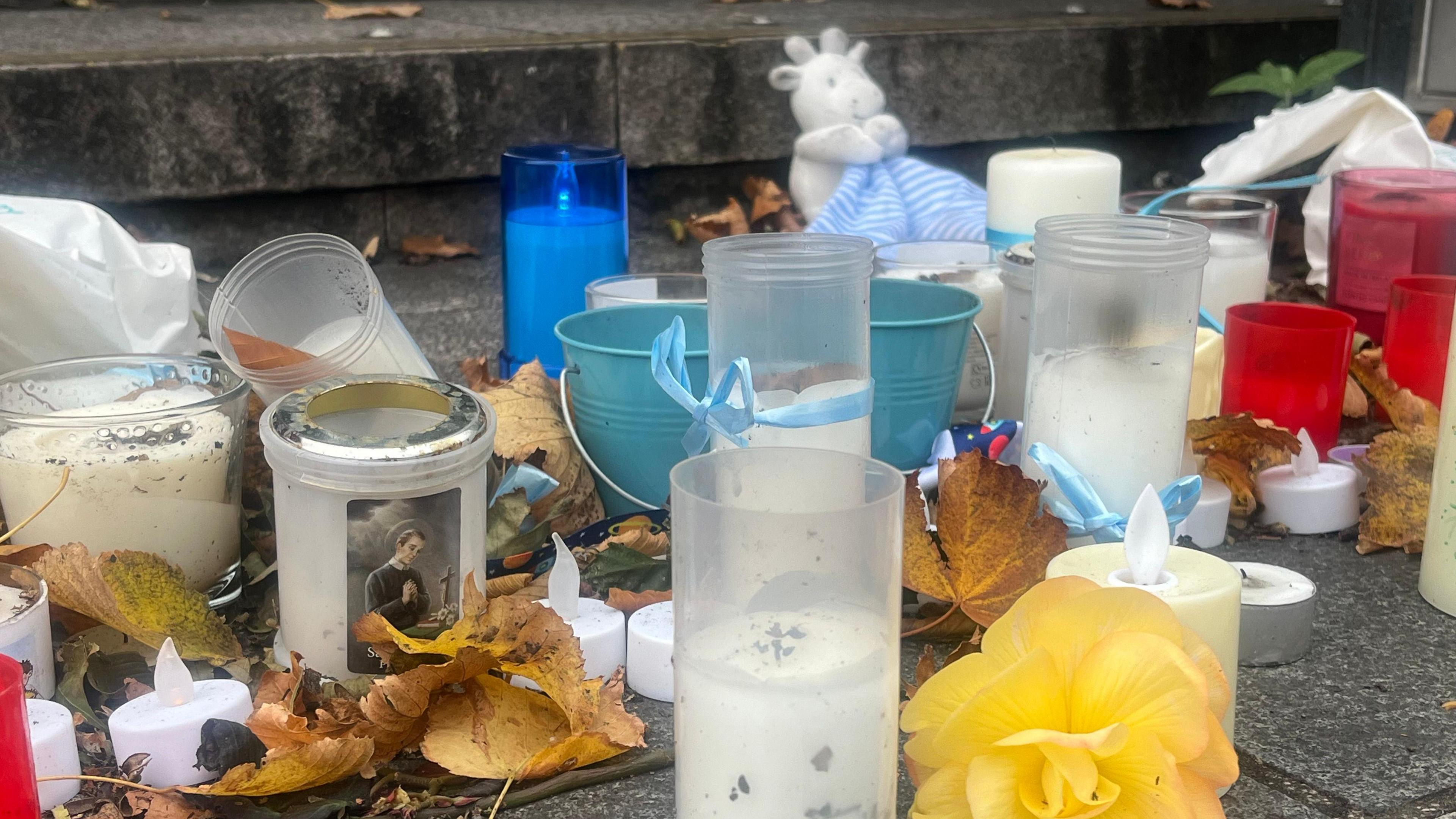 The remnants of candles and tributes to Kyran after last weekend's vigil