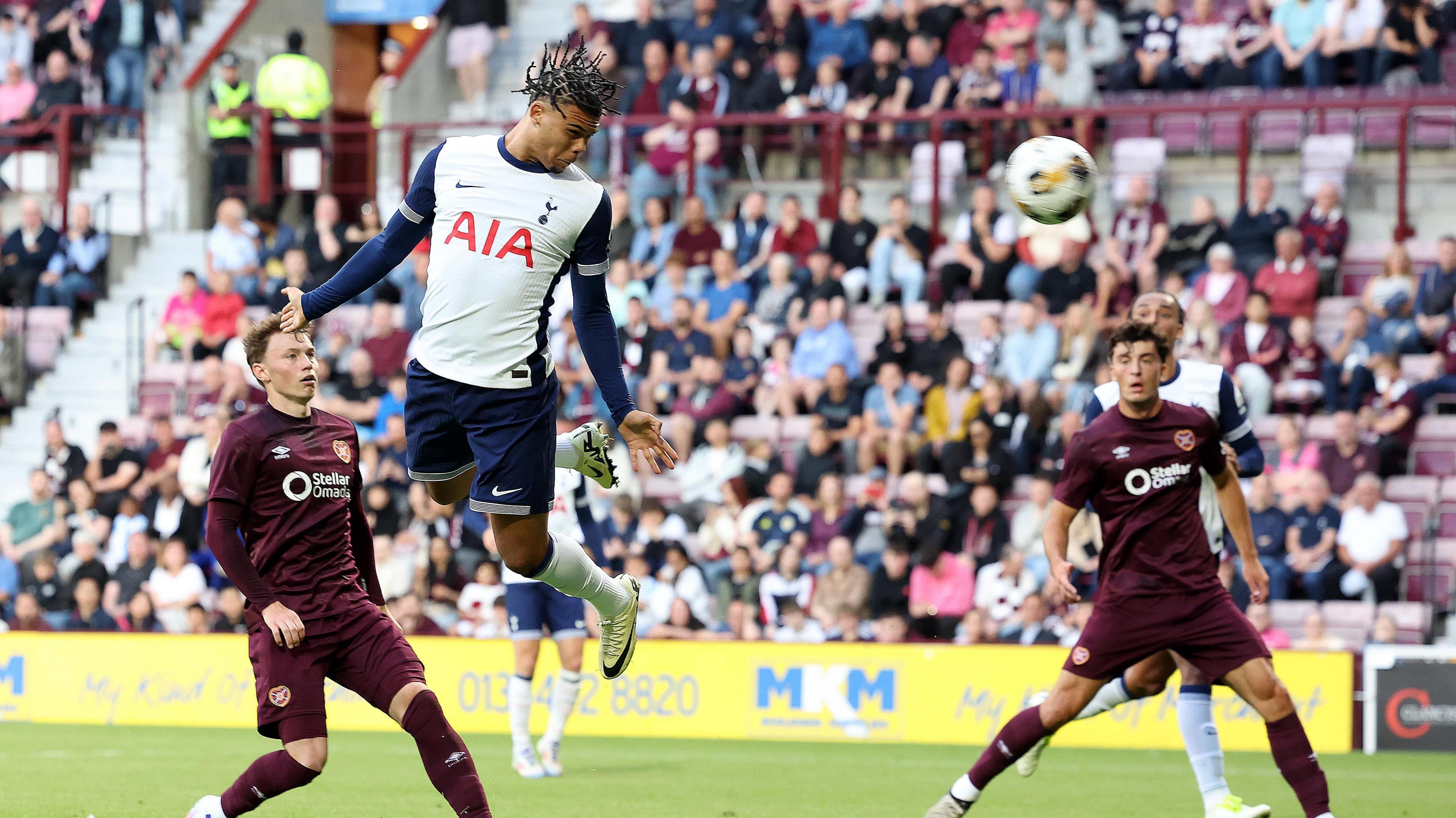 Dane Scarlett wins a header for Tottenham vs Hearts in pre-season