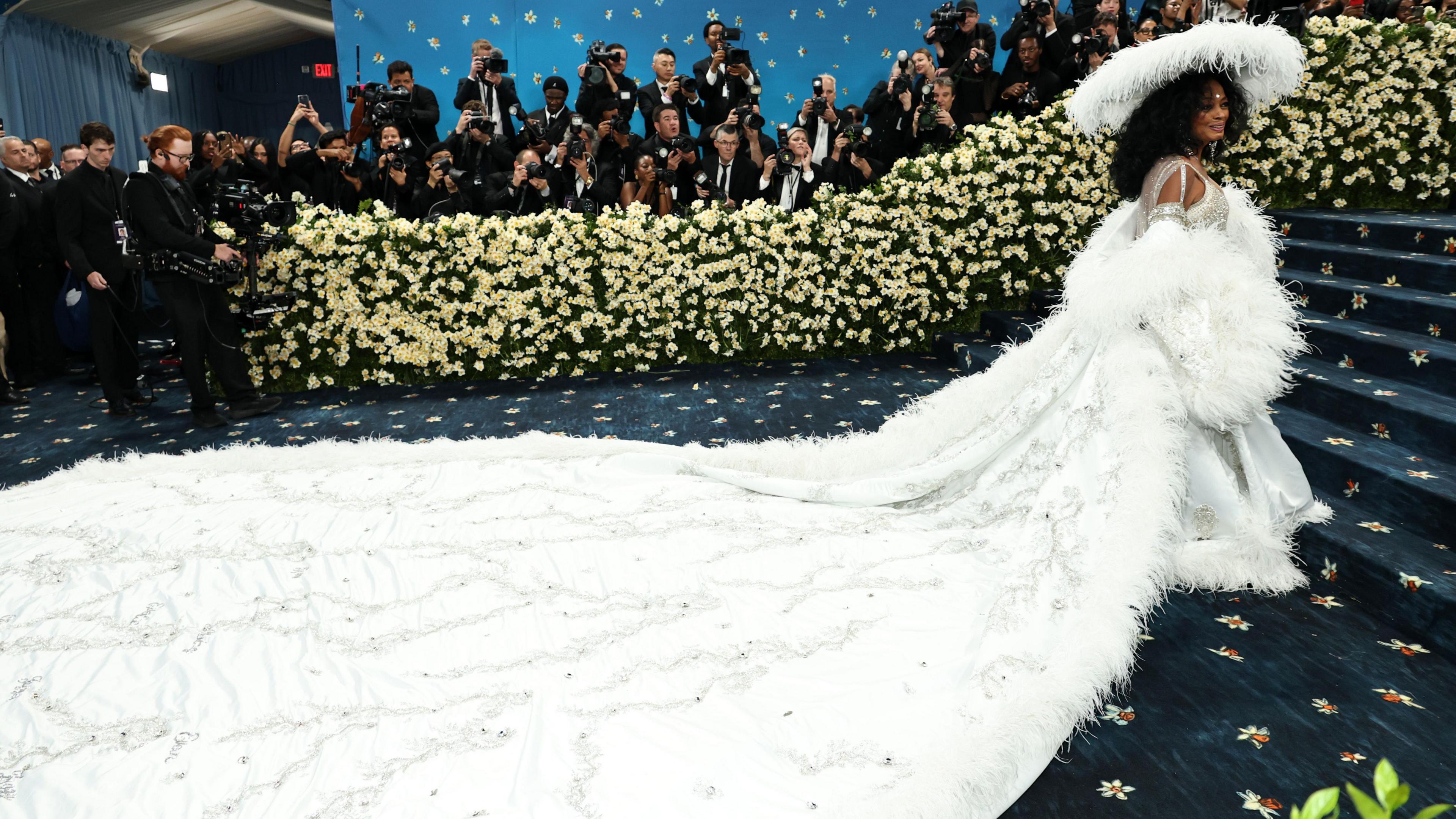 Diana Ross in white dress with 18-foot train