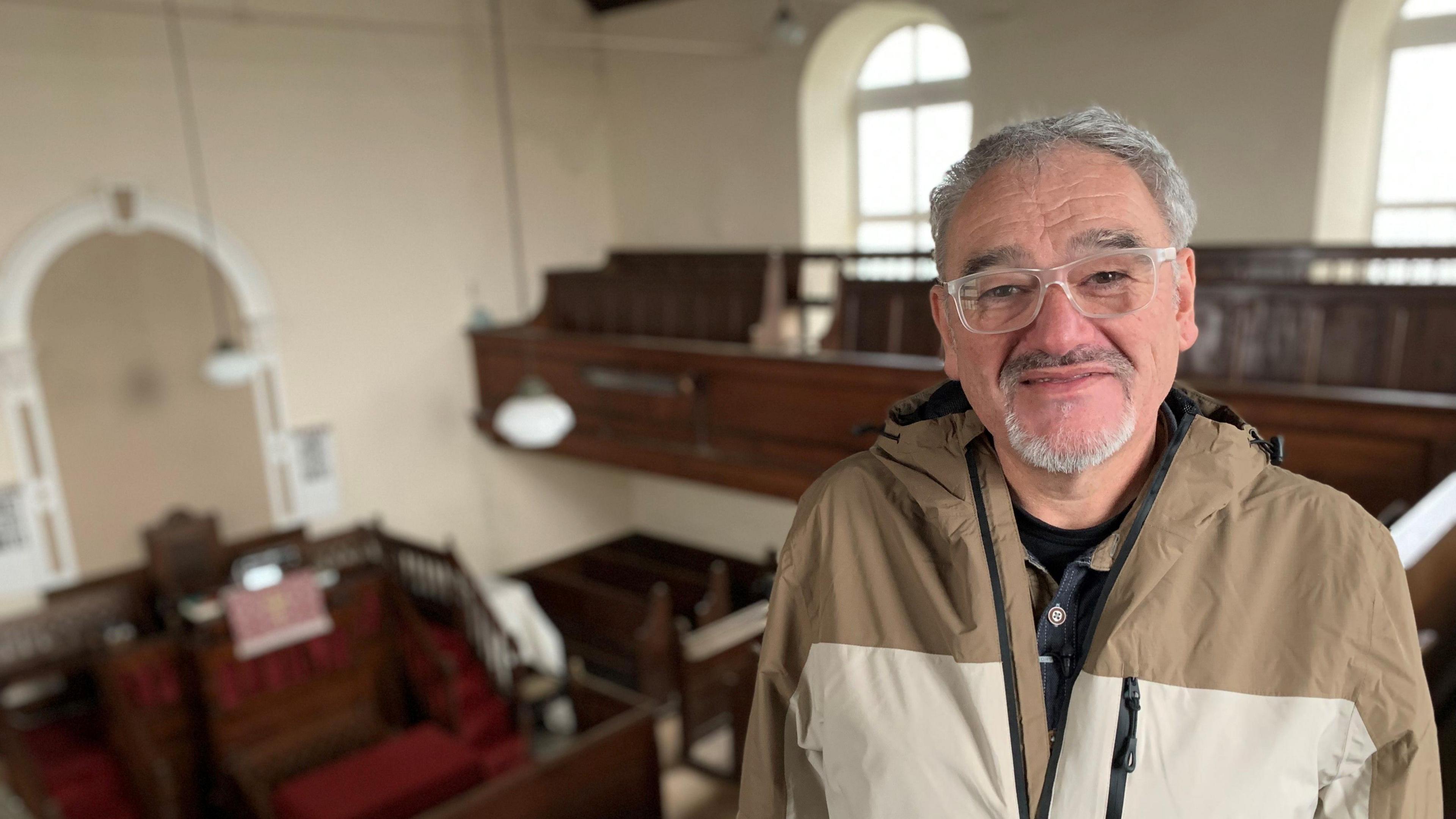 Chris Tomos in the former chapel