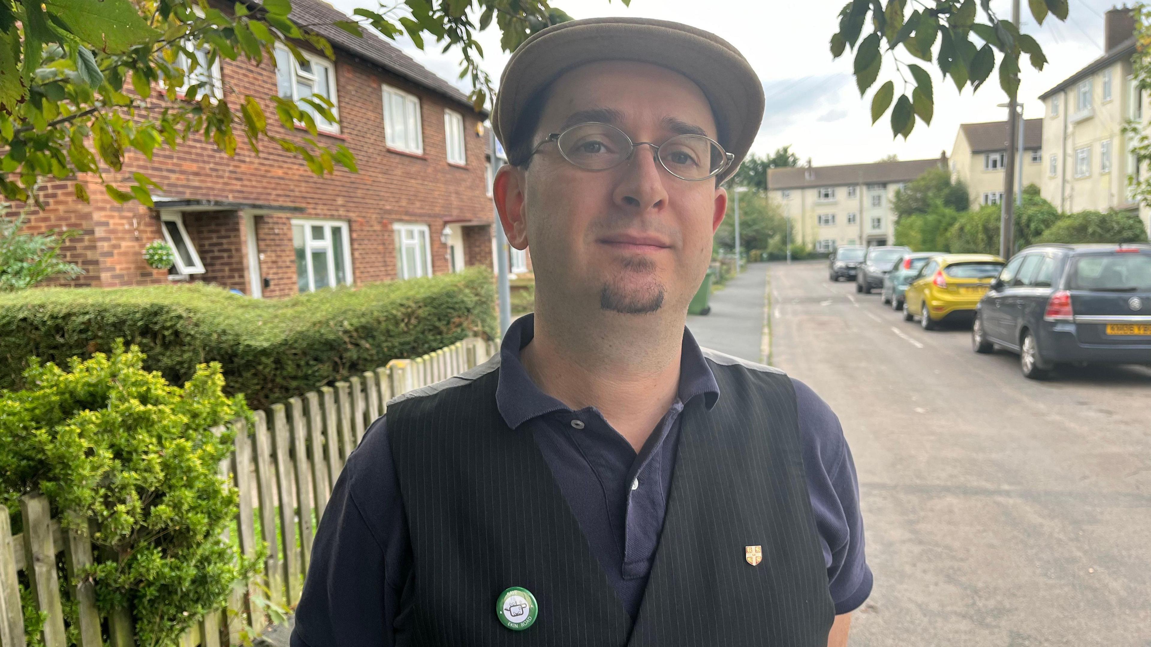 Maurice Chiodo outside houses in Ekin Road