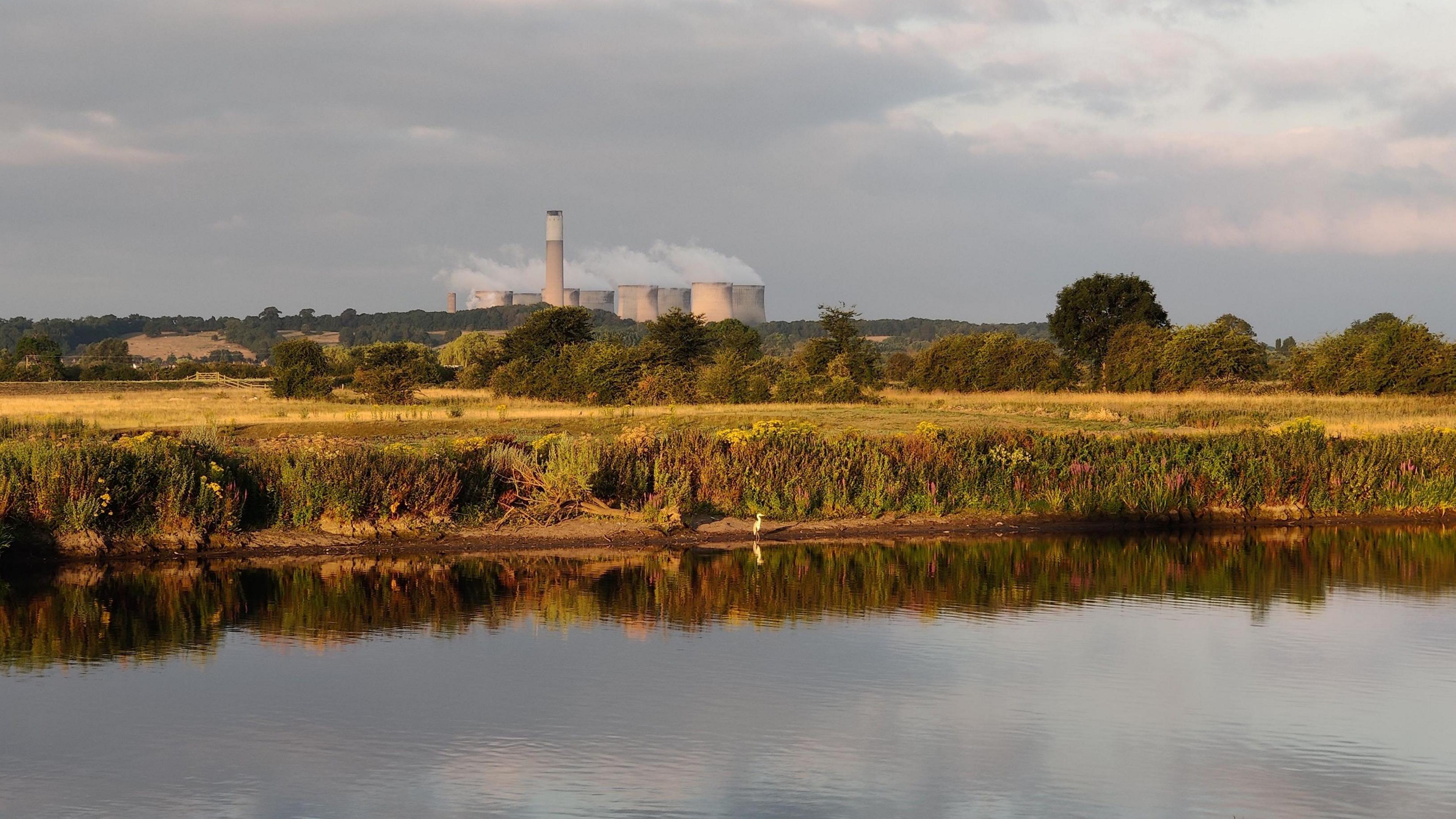 The river and banks of the River Trent, with Ratcliffe-on-Soar power station in the background