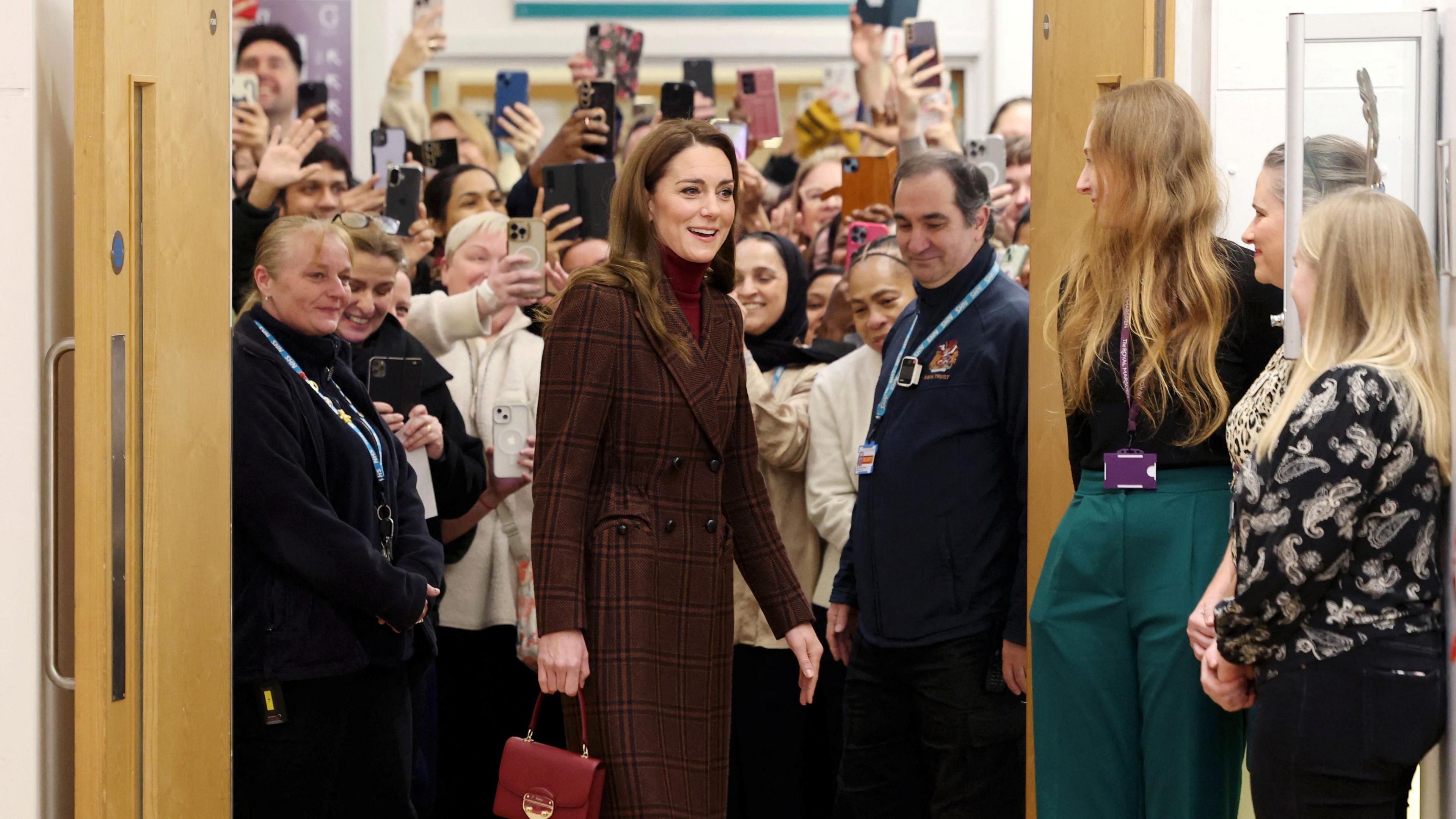 Phone cameras being held up as the Princess of Wales visited the Royal Marsden Hospital in west London